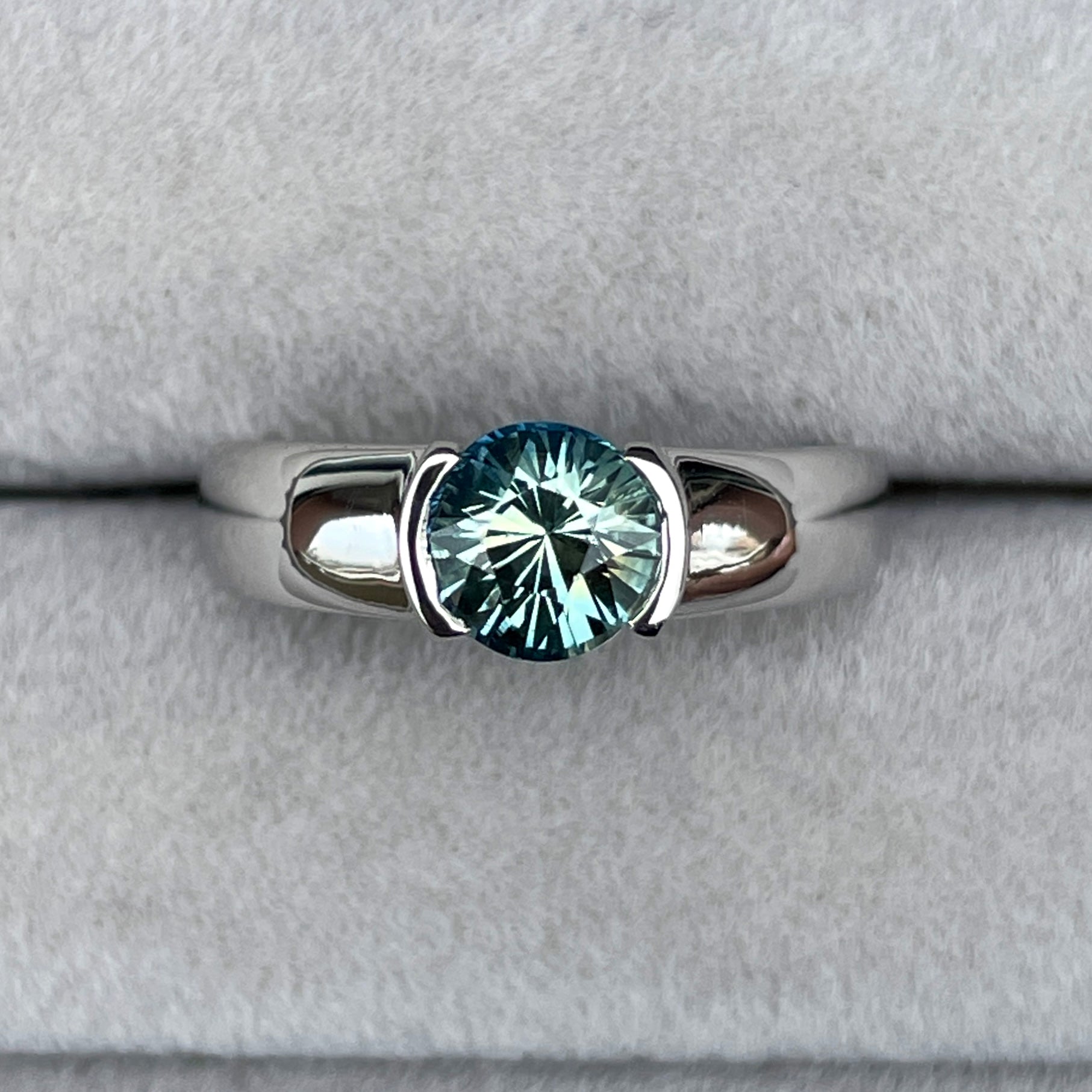 Engagement rings with teal and blue sapphires in white gold