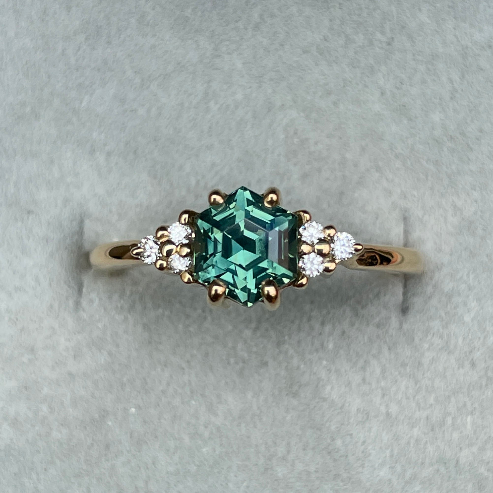 Before and after cleaning teal sapphire ring