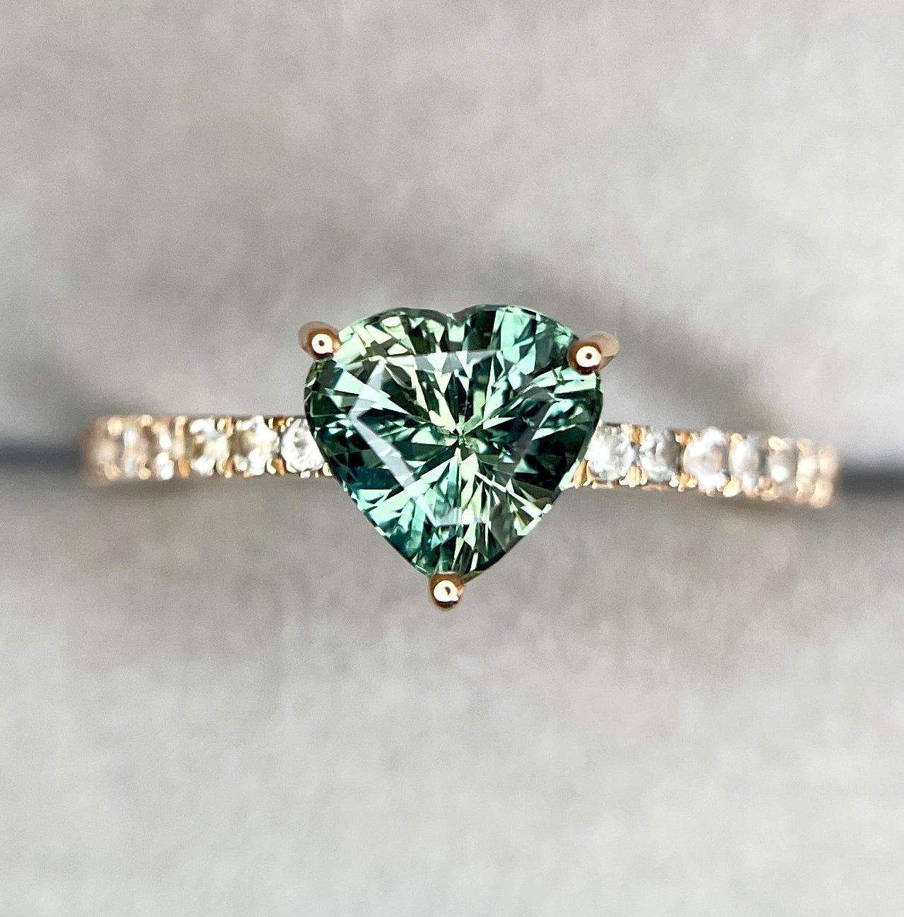 Close-up of parti sapphire ring being gently cleaned with a soft cloth