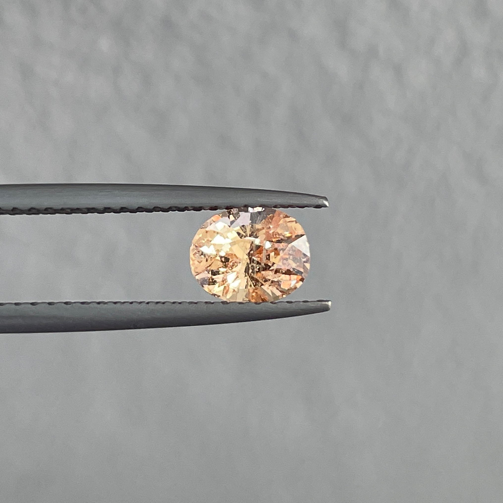 natural peach sapphire with inclusions