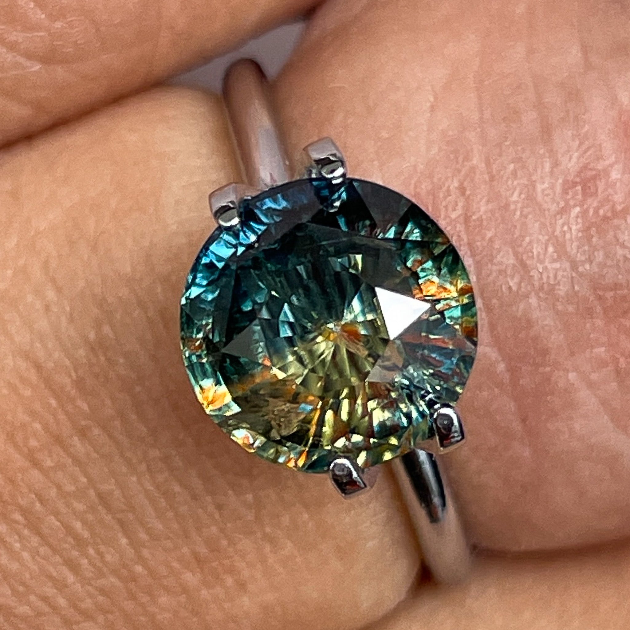Natural teal bi-color sapphire, 3.70 Ct round cut, loose gemstone from NASHGEMS, ideal for engagement rings or custom jewelry.