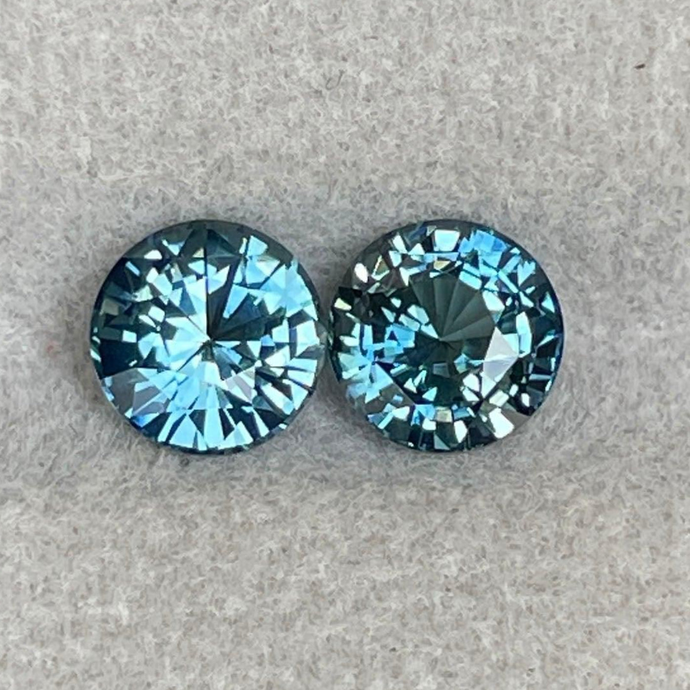 Pair of blue-green teal sapphires in round cut, 2.26 ct., ideal for anniversary, Mother's Day, or personalized engagement rings.