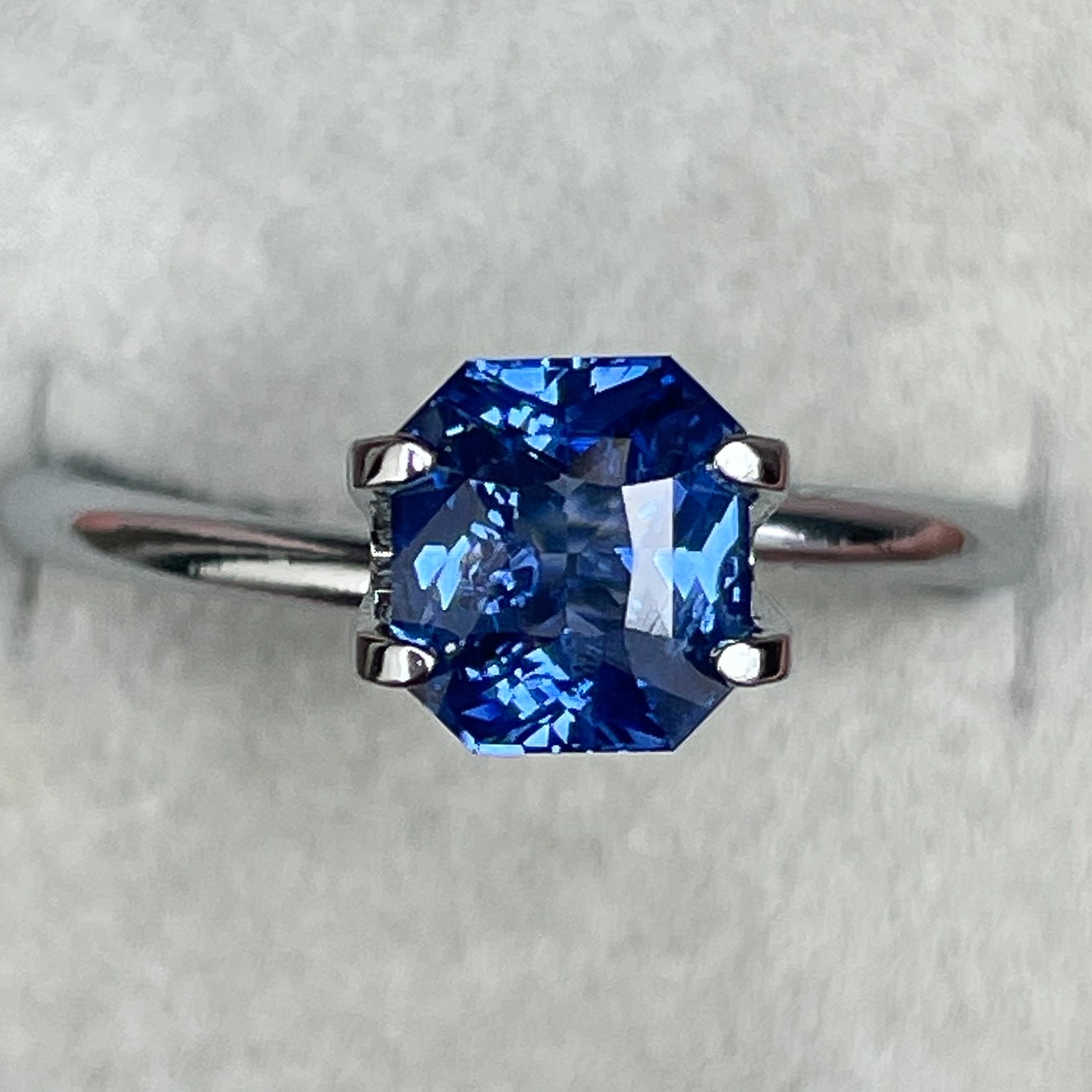 Natural Ceylon blue sapphire 1.52 Ct radiant cut by NASHGEMS, vivid blue loose gemstone for jewelry or engagement rings.