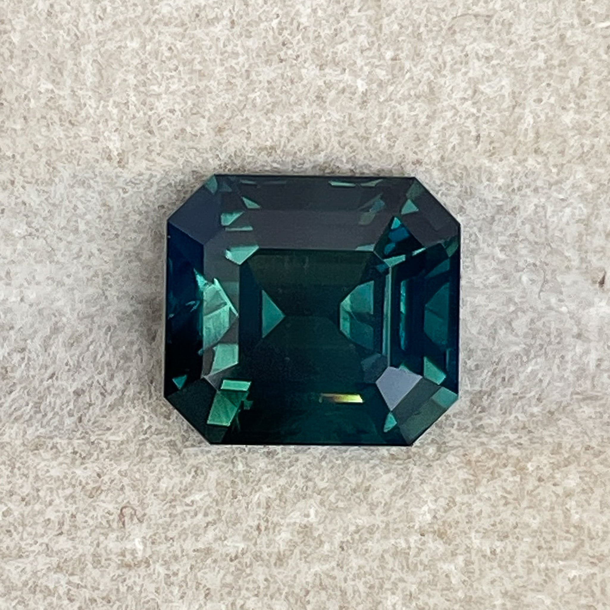 Natural forest green sapphire, 3.59 Ct emerald cut loose teal gemstone by NASHGEMS for custom engagement rings.