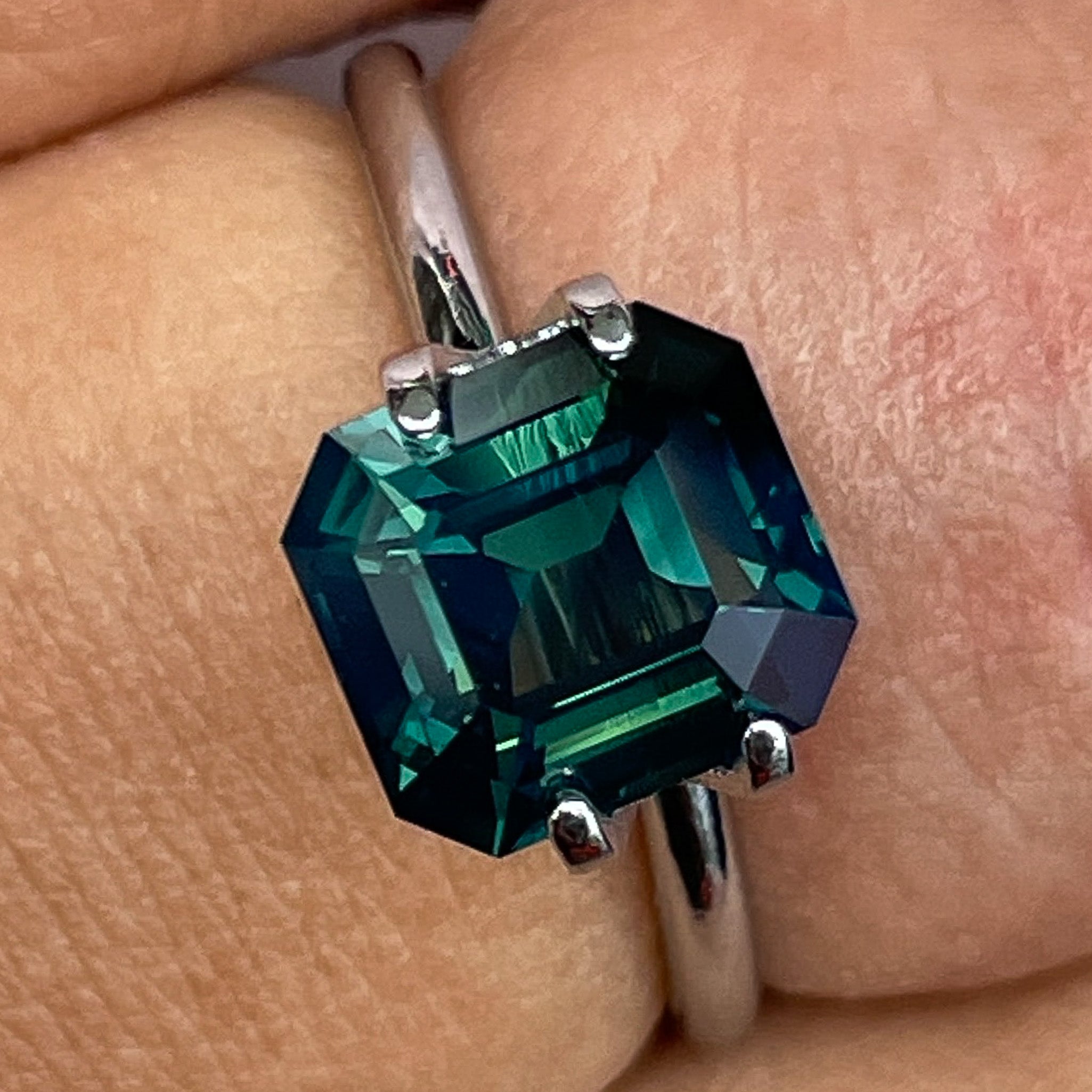Dark green natural forest teal sapphire loose gemstone, 3.59 carats in emerald cut, ideal for custom engagement rings.