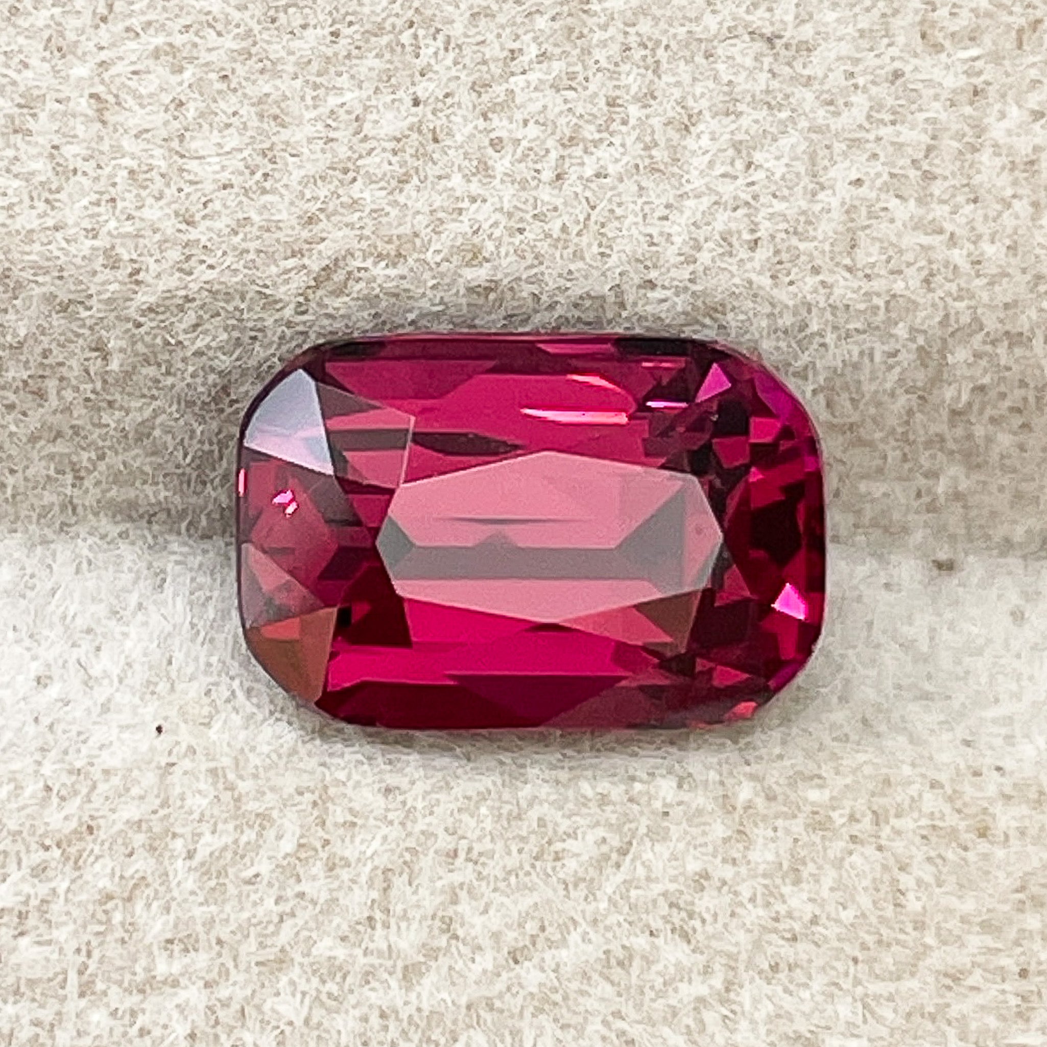 Natural Rhodolite Garnet 3.18 Ct cushion cut gemstone from NASHGEMS, vibrant raspberry red VVS loose garnet for jewelry.