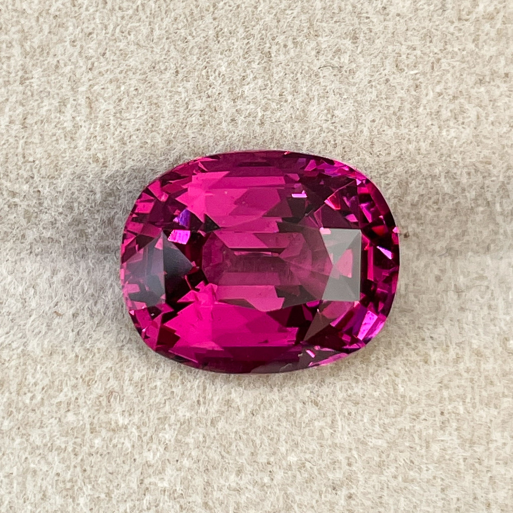 Oval cut Natural Rhodolite Garnet 7.07 Ct with raspberry red color, VVS clarity, suitable for engagement rings, by NASHGEMS.
