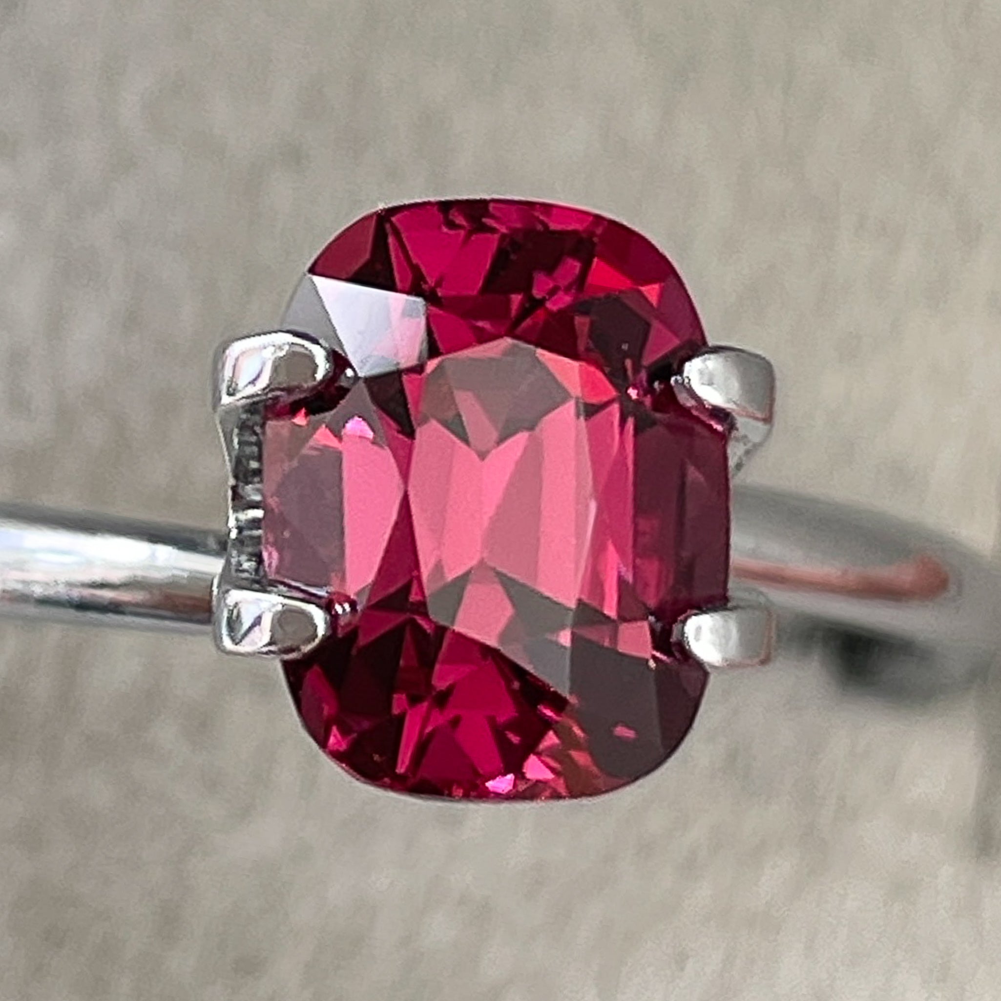 Natural Rhodolite Garnet 2.14 Ct cushion cut loose gemstone in raspberry red, VVS clarity for engagement jewelry.