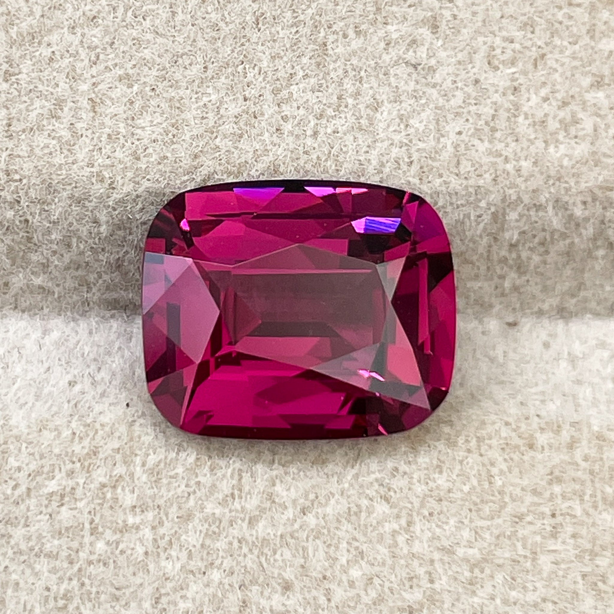Natural Rhodolite Garnet 4.14 Ct cushion cut gemstone in raspberry red, VVS clarity, loose garnet for engagement rings.