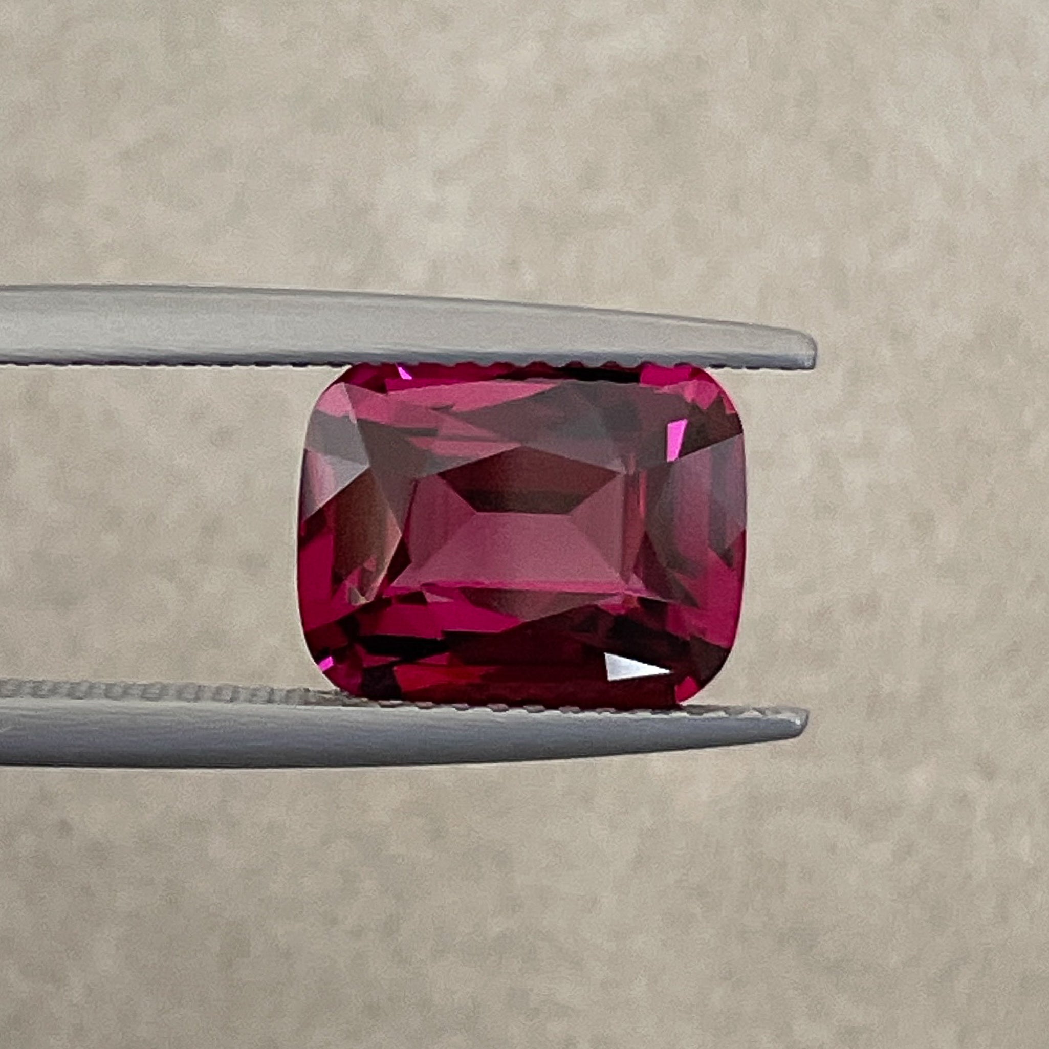 Natural Rhodolite Garnet 4.14 Ct cushion cut loose gemstone in raspberry red, VVS clarity, ideal for engagement rings.