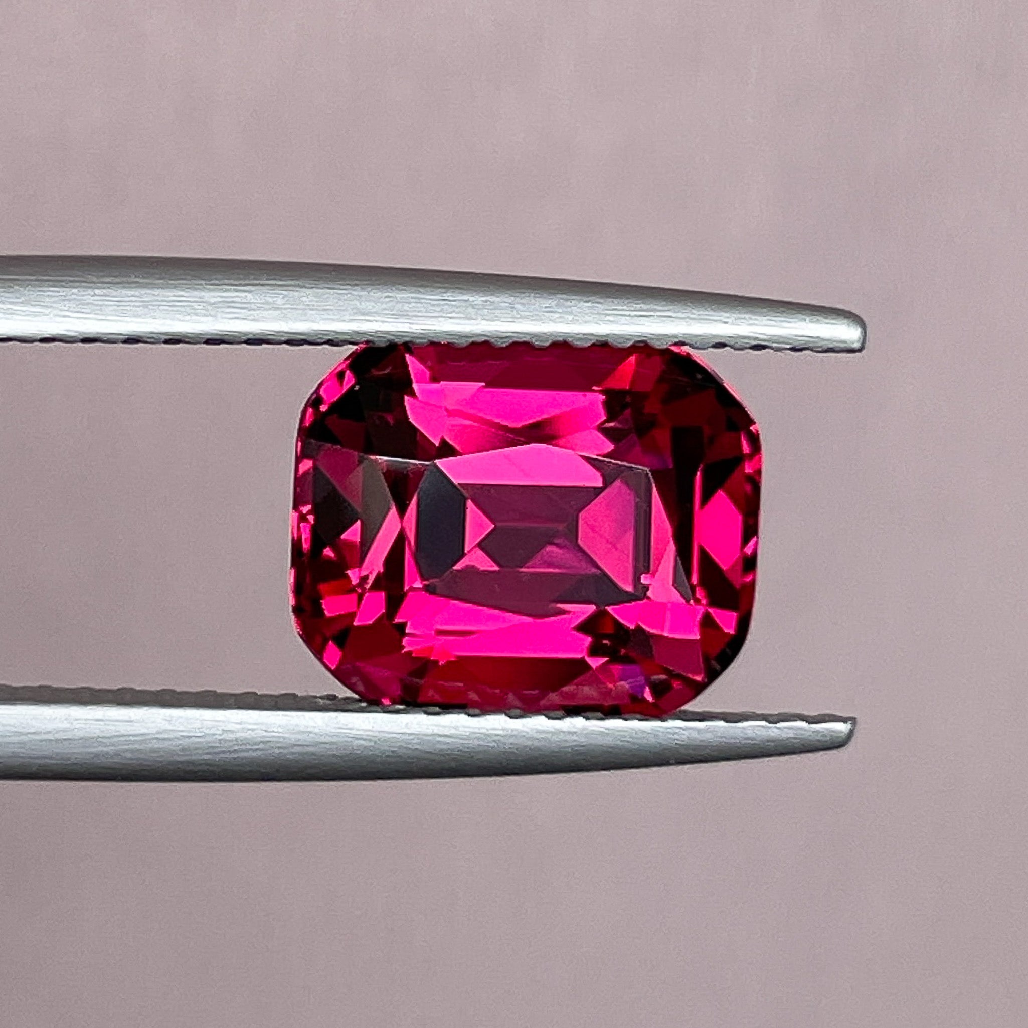 Natural Rhodolite Garnet 4.53 Ct cushion cut loose stone in raspberry red, VVS clarity, ideal for engagement rings.