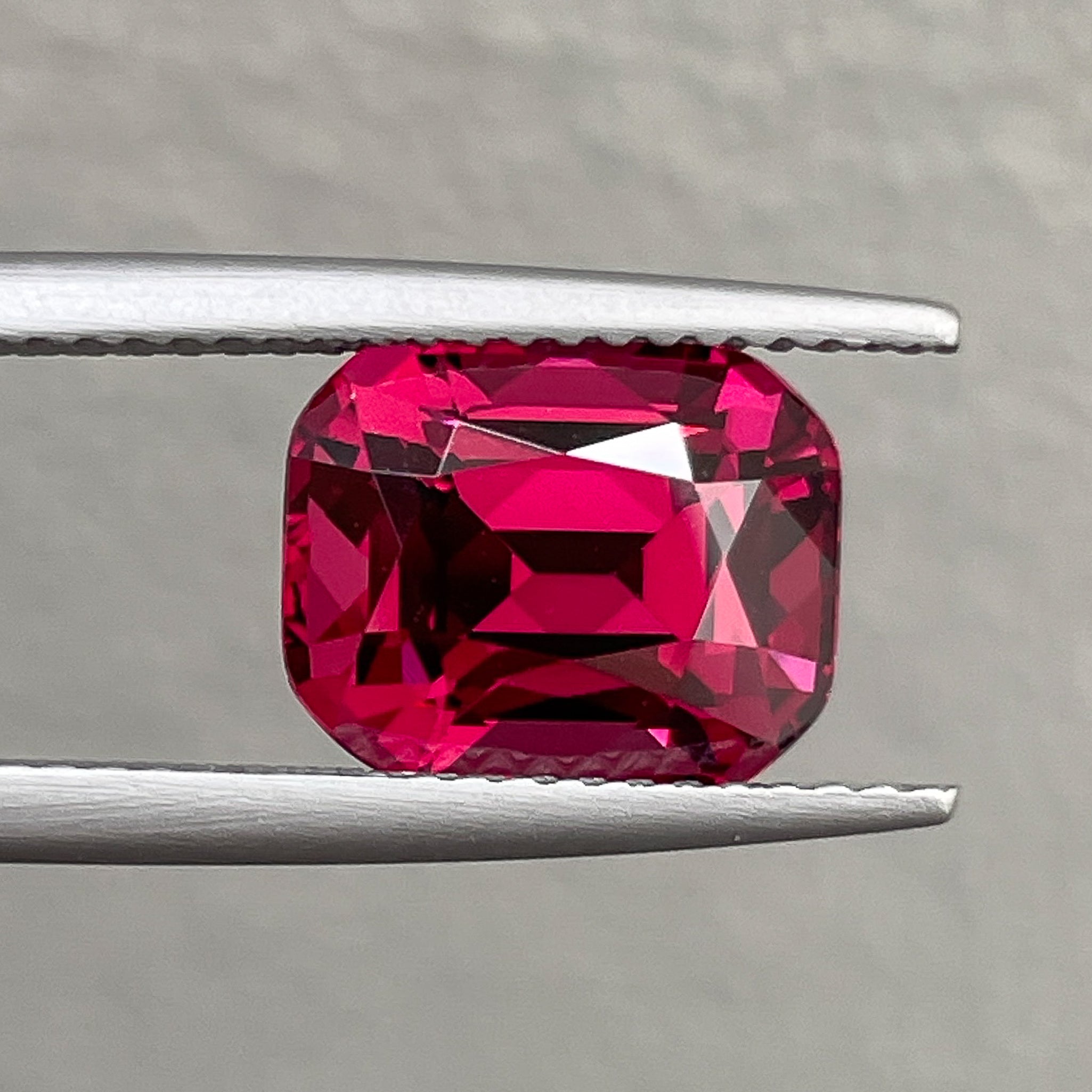 Natural Rhodolite Garnet 4.53 Ct cushion cut gemstone with raspberry red color, loose VVS garnet for engagement rings.