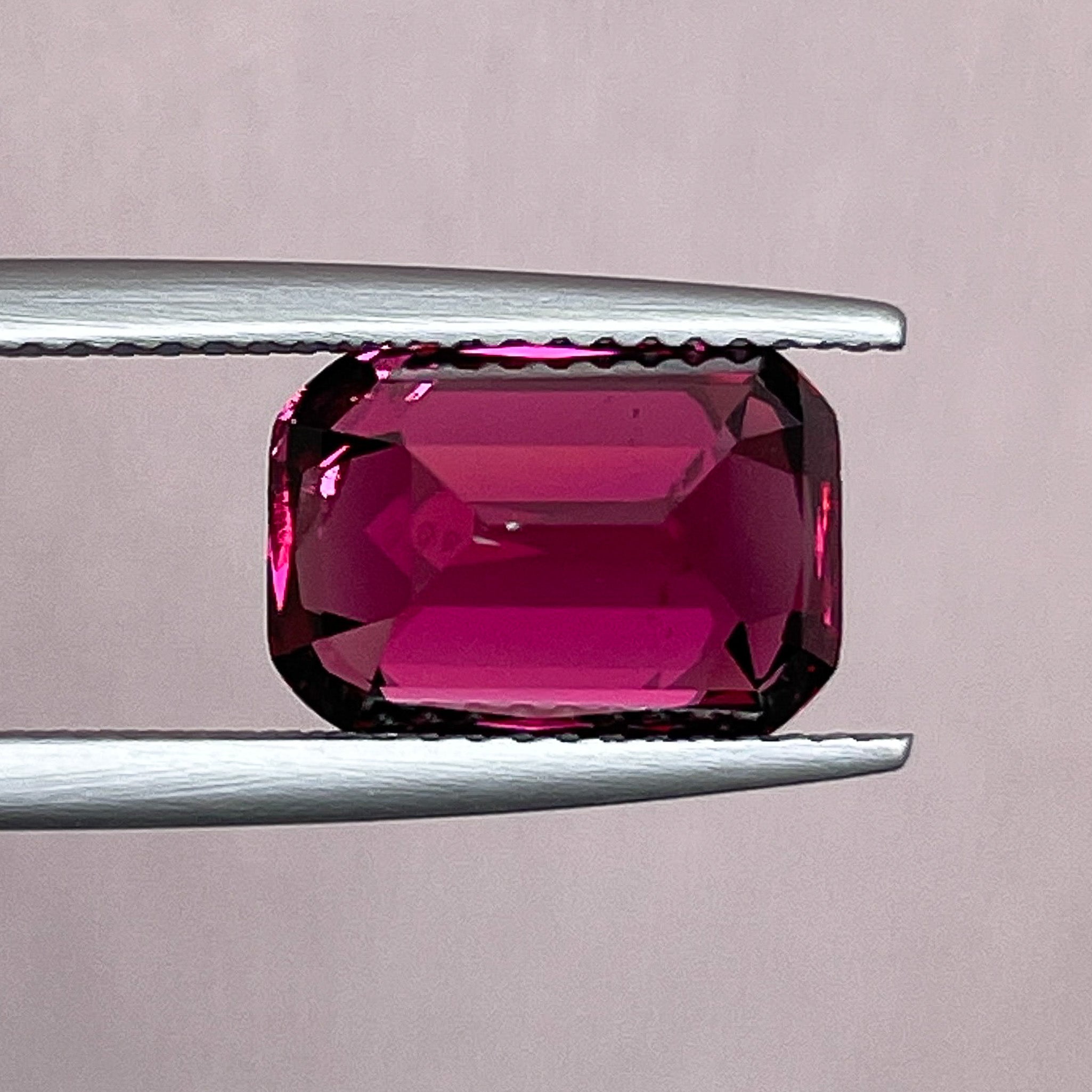 Natural Rhodolite Garnet 5 ct cushion cut loose gemstone in raspberry red, perfect for engagement rings, by NASHGEMS.