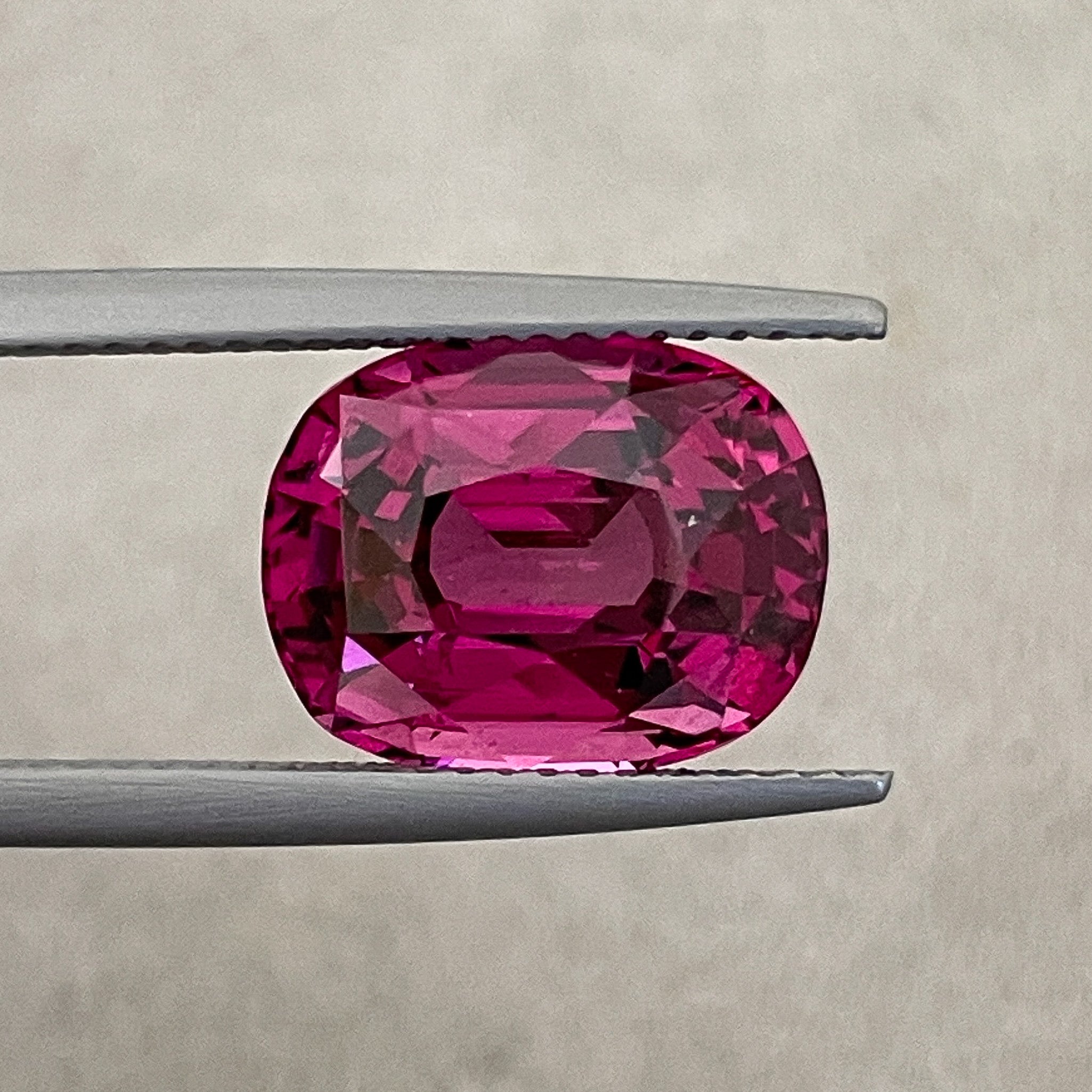 Natural Rhodolite Garnet 7.07 Ct oval cut gemstone with rich raspberry red color, VVS clarity, ideal for engagement rings.