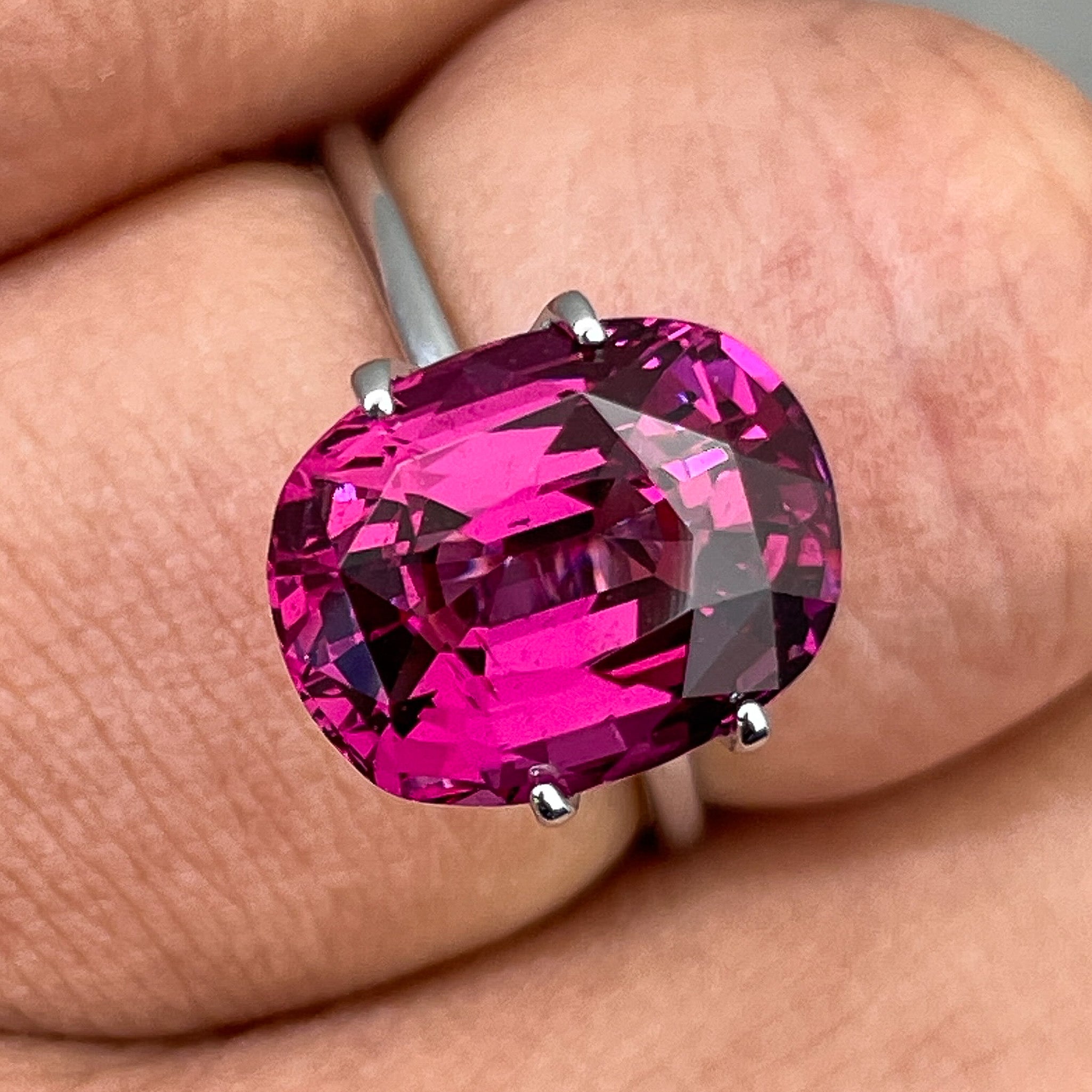 Natural Rhodolite Garnet 7.07 Ct oval cut gemstone by NASHGEMS, showcasing vibrant raspberry red color for engagement jewelry.
