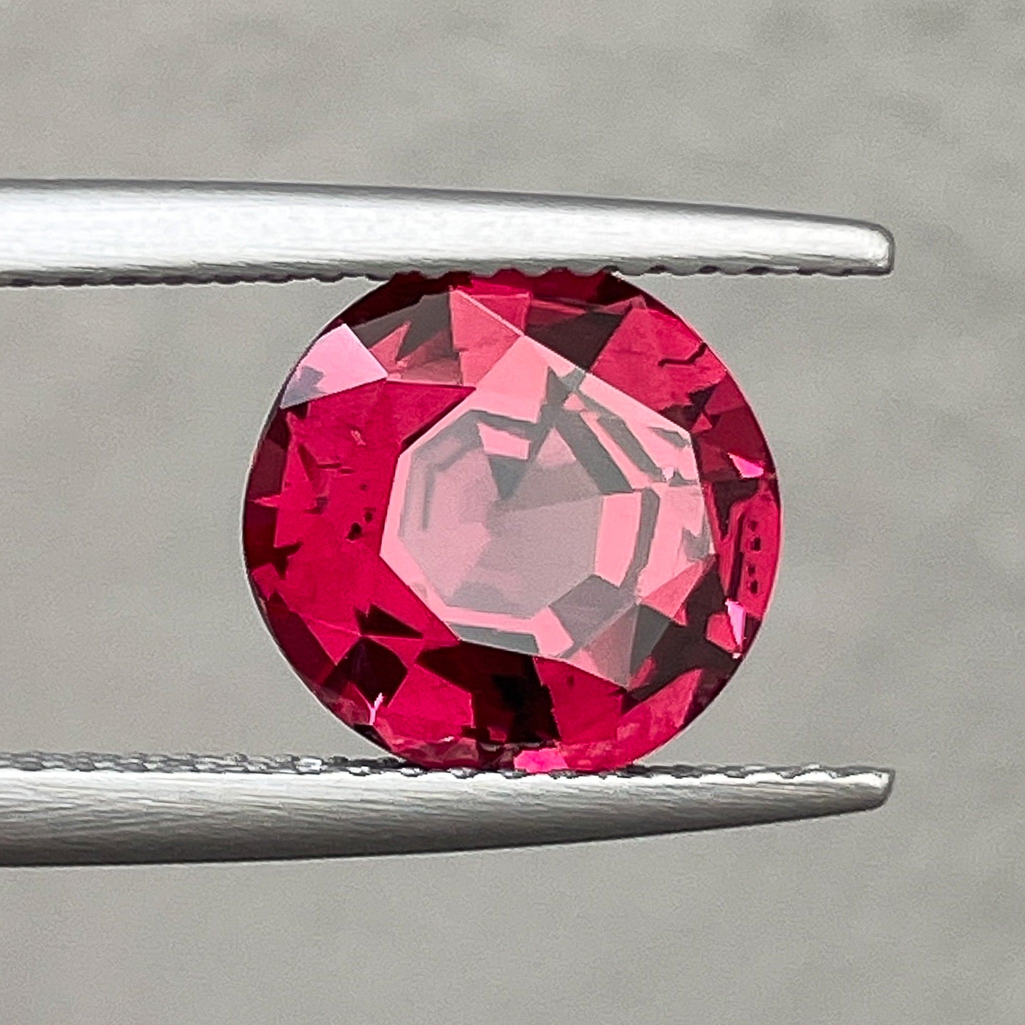 Natural Rhodolite Garnet 3.13 Ct round cut gemstone with raspberry red color, VVS clarity, for engagement rings from NASHGEMS.