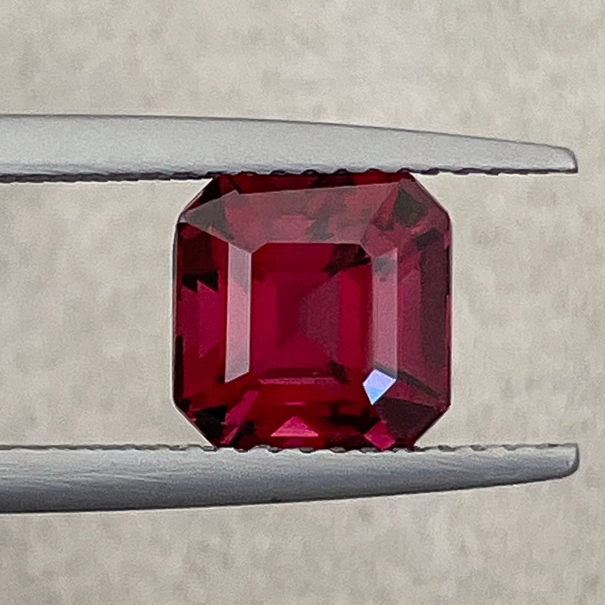 Natural Pyrope Almandite Garnet 3.38 Ct emerald cut loose gemstone showing deep red color and VVS clarity, ideal for jewelry making.