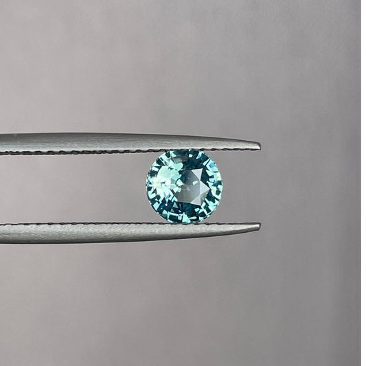 This 0.96 crt Teal Sapphire is well cut to bring out the best colour and lustre, and has a perfect colour blend.\