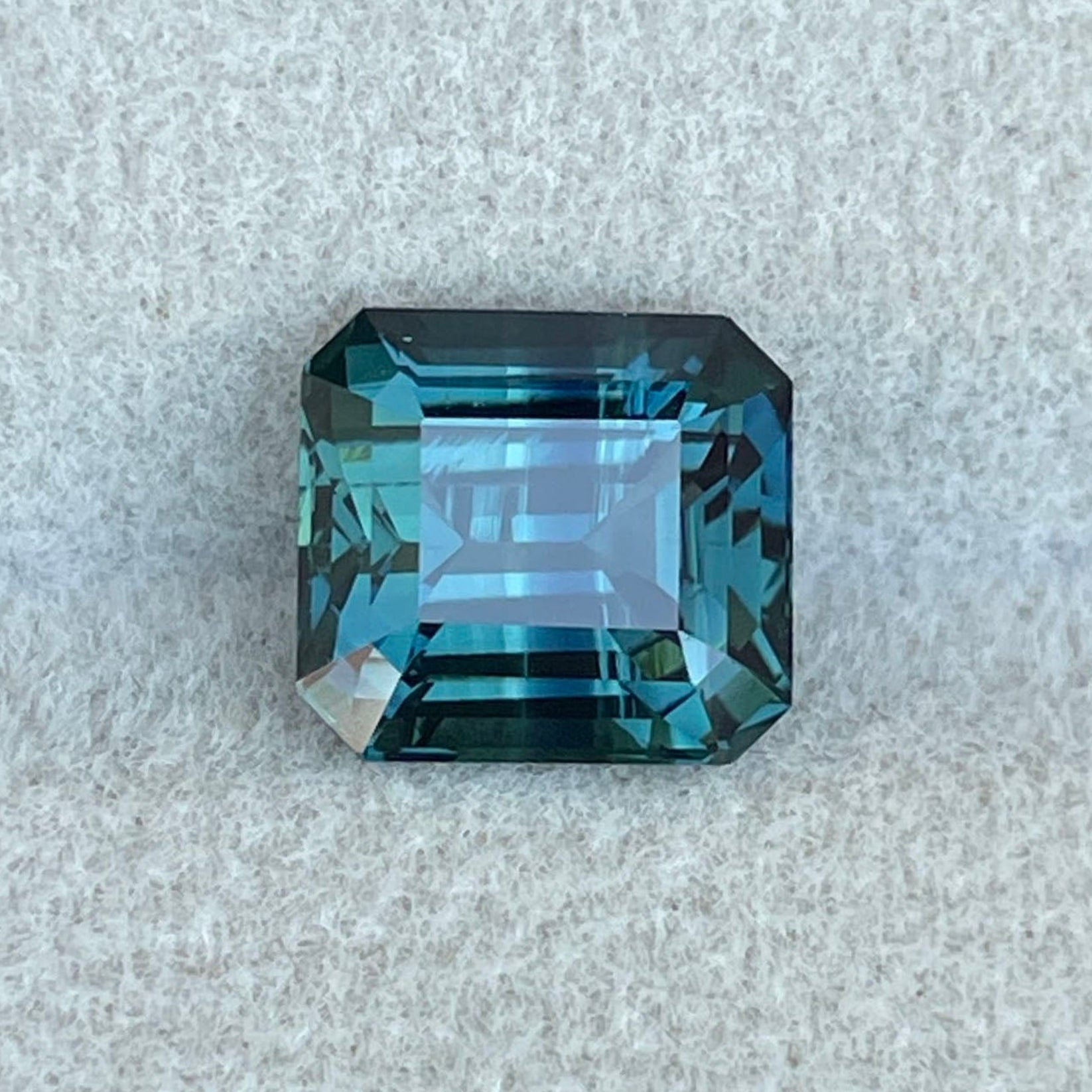 Natural teal blue green sapphire gemstone, emerald cut, 3.94 carats, untreated loose sapphire for custom jewelry design.