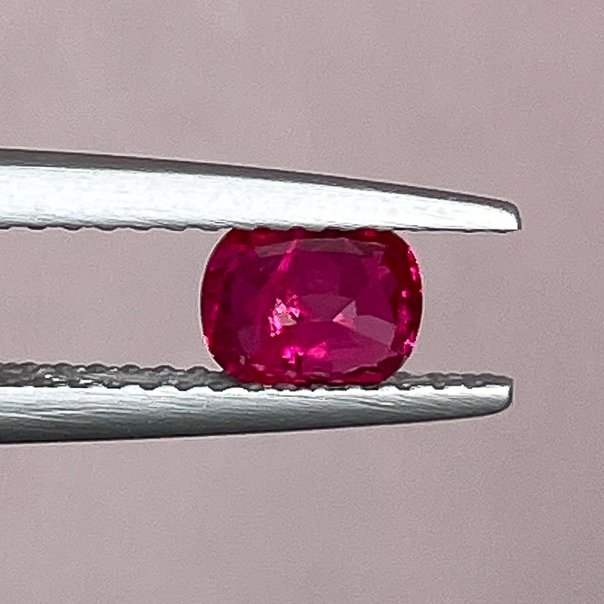 Natural ruby 0.67 ct cushion cut loose gemstone from NASHGEMS, ideal for engagement rings, no heat treatment, vibrant red color.