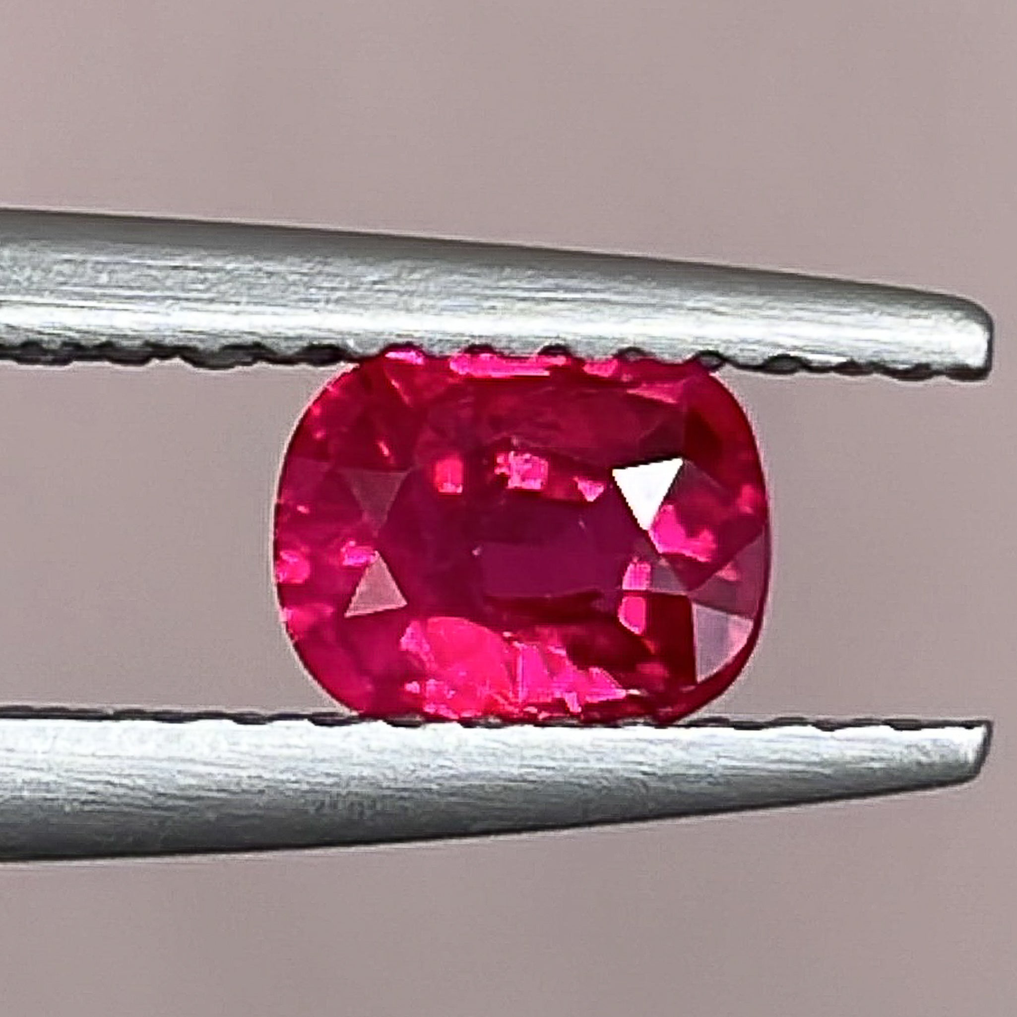 Natural 0.67 ct cushion cut ruby gemstone from NASHGEMS, loose, no heat, ideal for engagement rings.