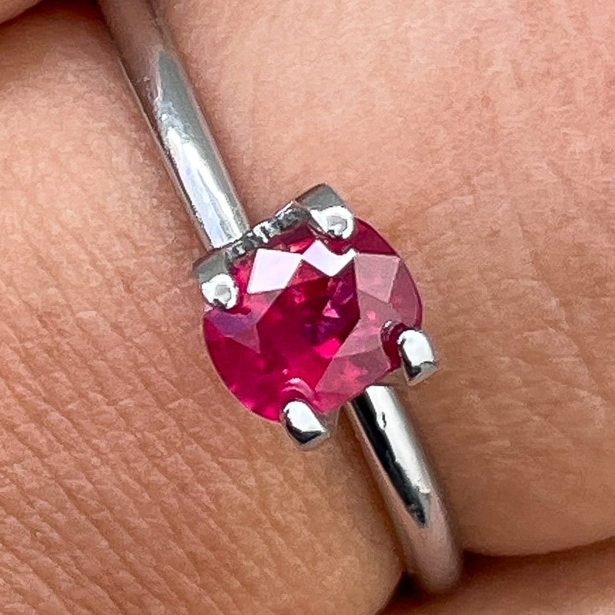 Natural Ruby 0.67 Ct cushion cut loose gemstone by NASHGEMS, showcasing vibrant red color and high-quality craftsmanship.