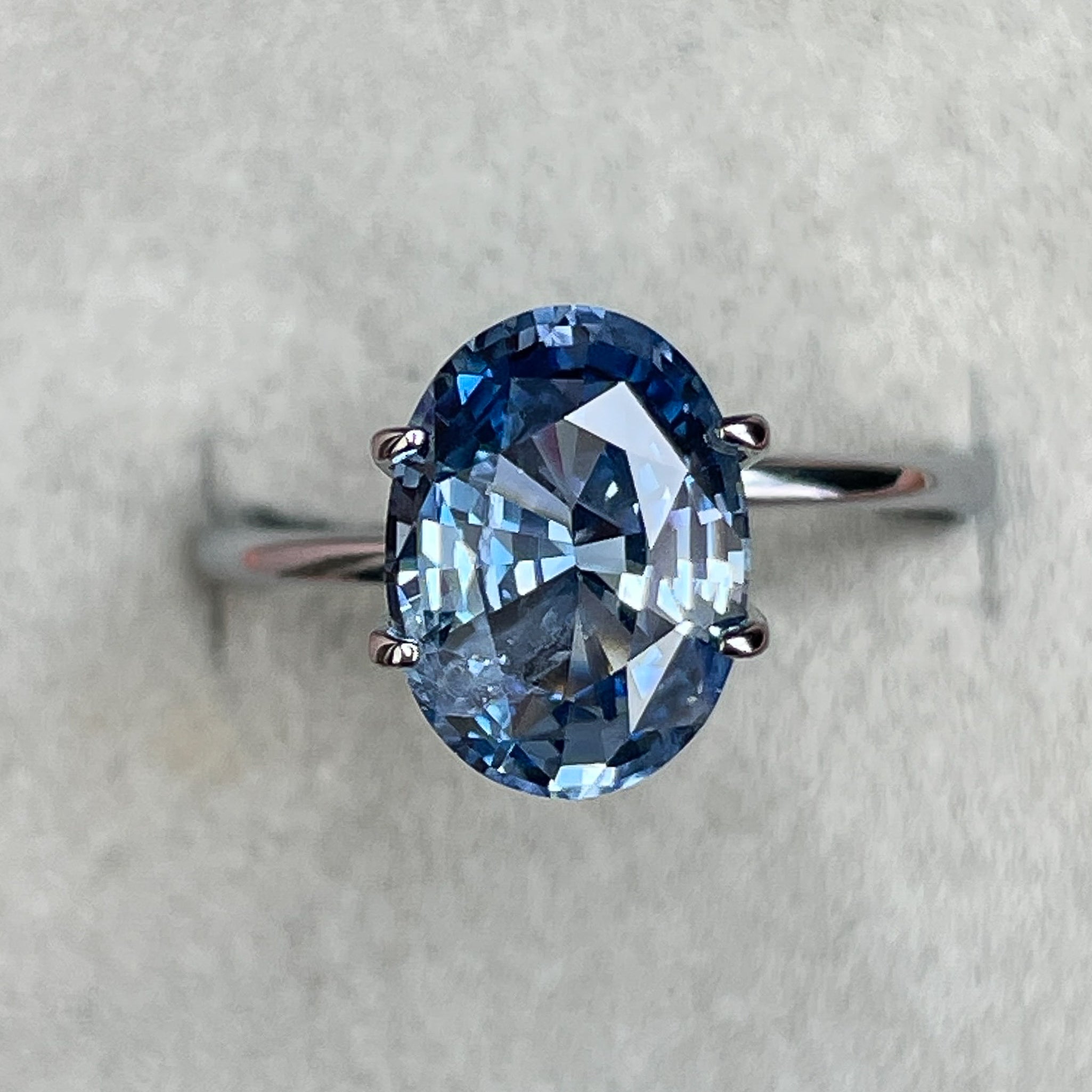 Natural Ceylon blue sapphire, 3.34 carats, oval cut, loose gemstone by NASHGEMS for engagement or custom jewelry.