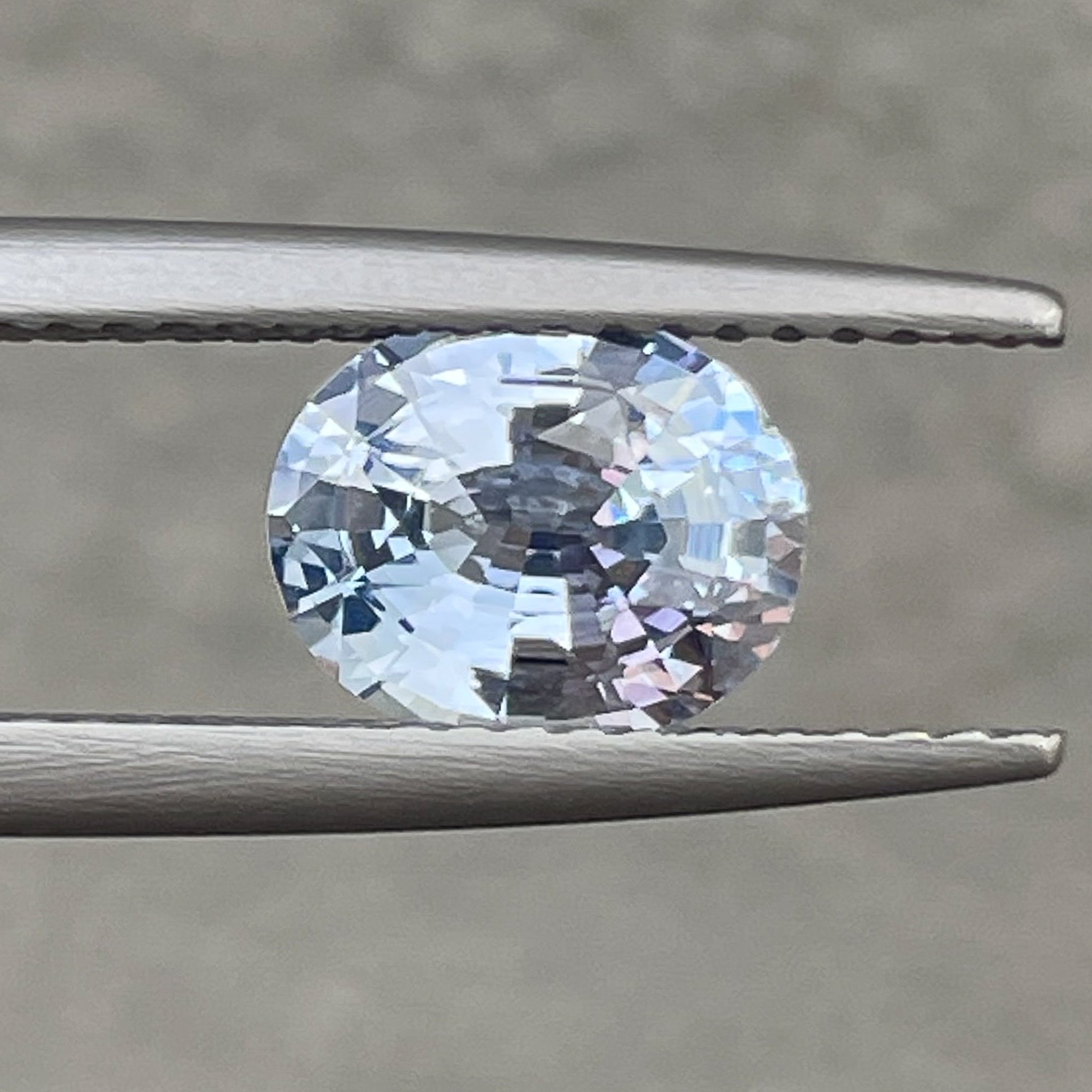 Natural Ceylon pale blue sapphire, 1.56 Ct oval cut loose gemstone by NASHGEMS, perfect for engagement rings.