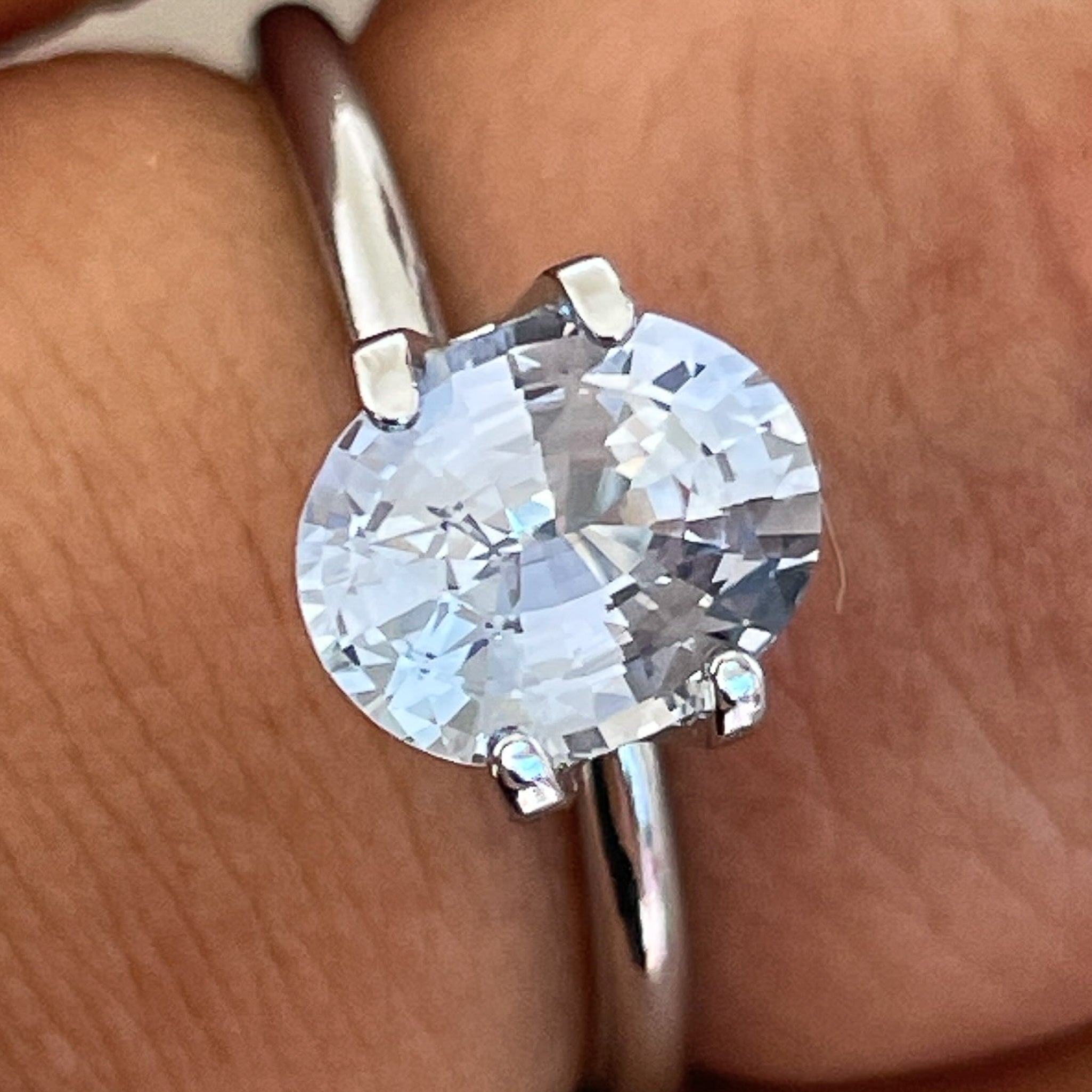 Natural Ceylon Pale Blue Sapphire 1.56 Ct oval cut loose gemstone by NASHGEMS, showcasing a vibrant, no heat VVS blue sapphire for jewelry.