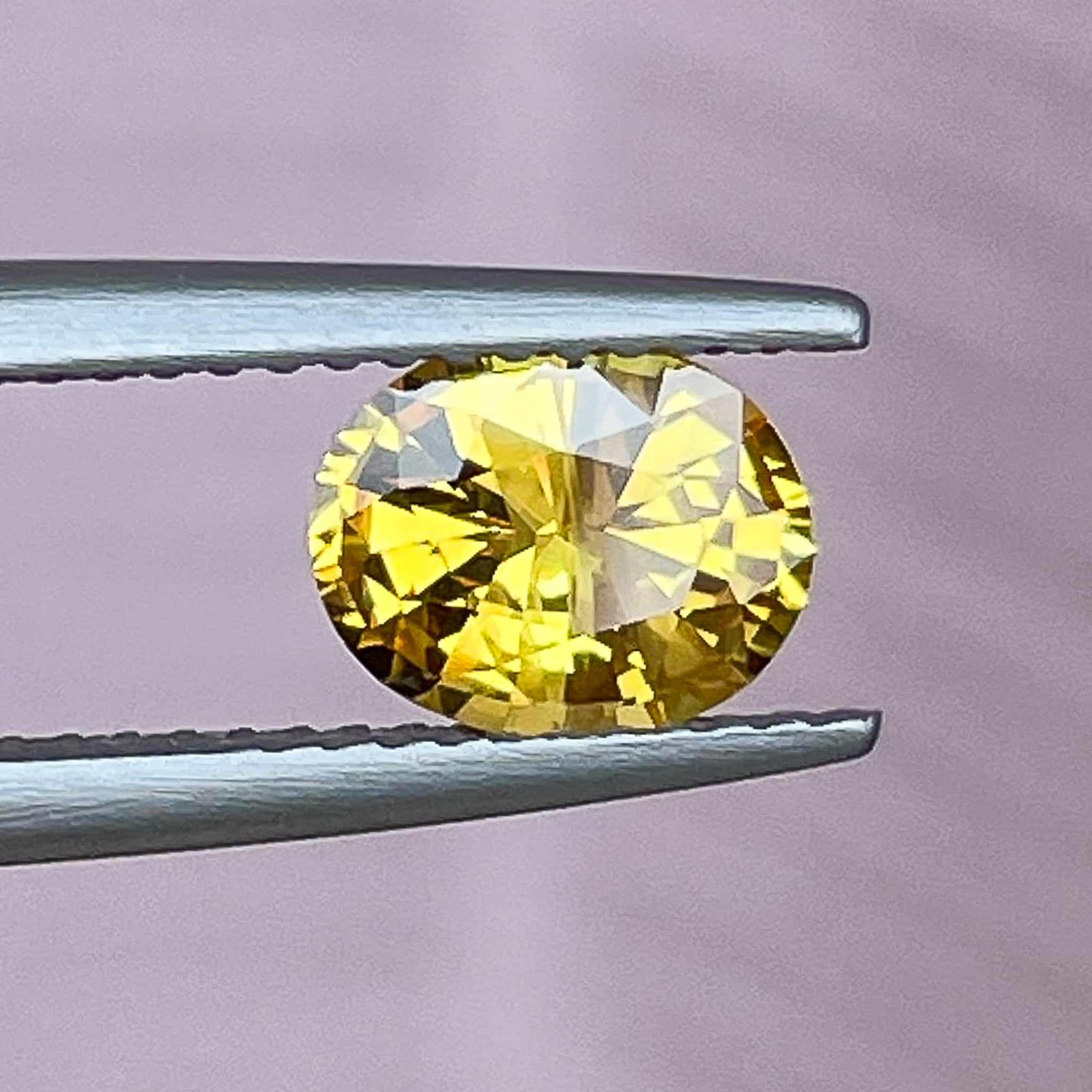 Natural yellow sapphire loose gemstone, 1.27 Ct oval cut, heat treated, from NASHGEMS, ideal for engagement rings.