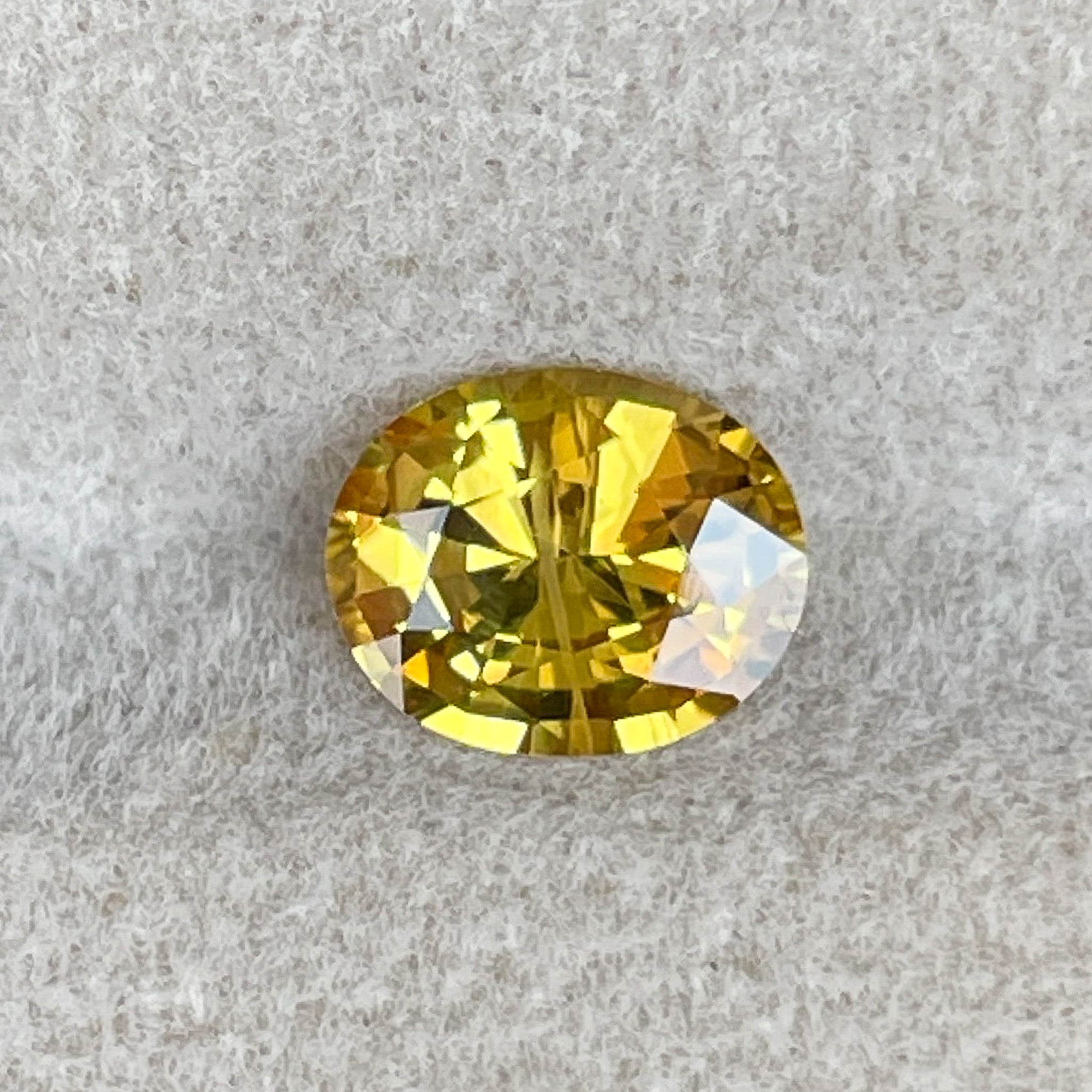 Natural yellow sapphire gemstone, 1.27 ct oval cut, heat-treated loose yellow sapphire by NASHGEMS for engagement or jewelry.