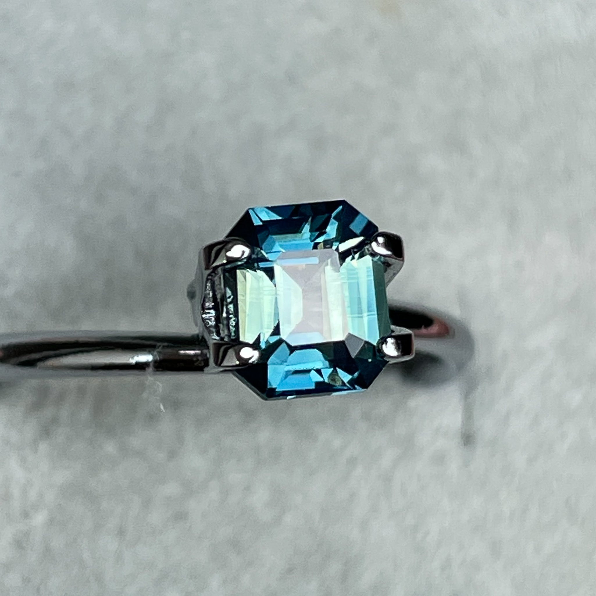 Natural teal blue-green bi-color sapphire, 1.38 Ct emerald cut, loose gemstone by NASHGEMS for engagement rings.