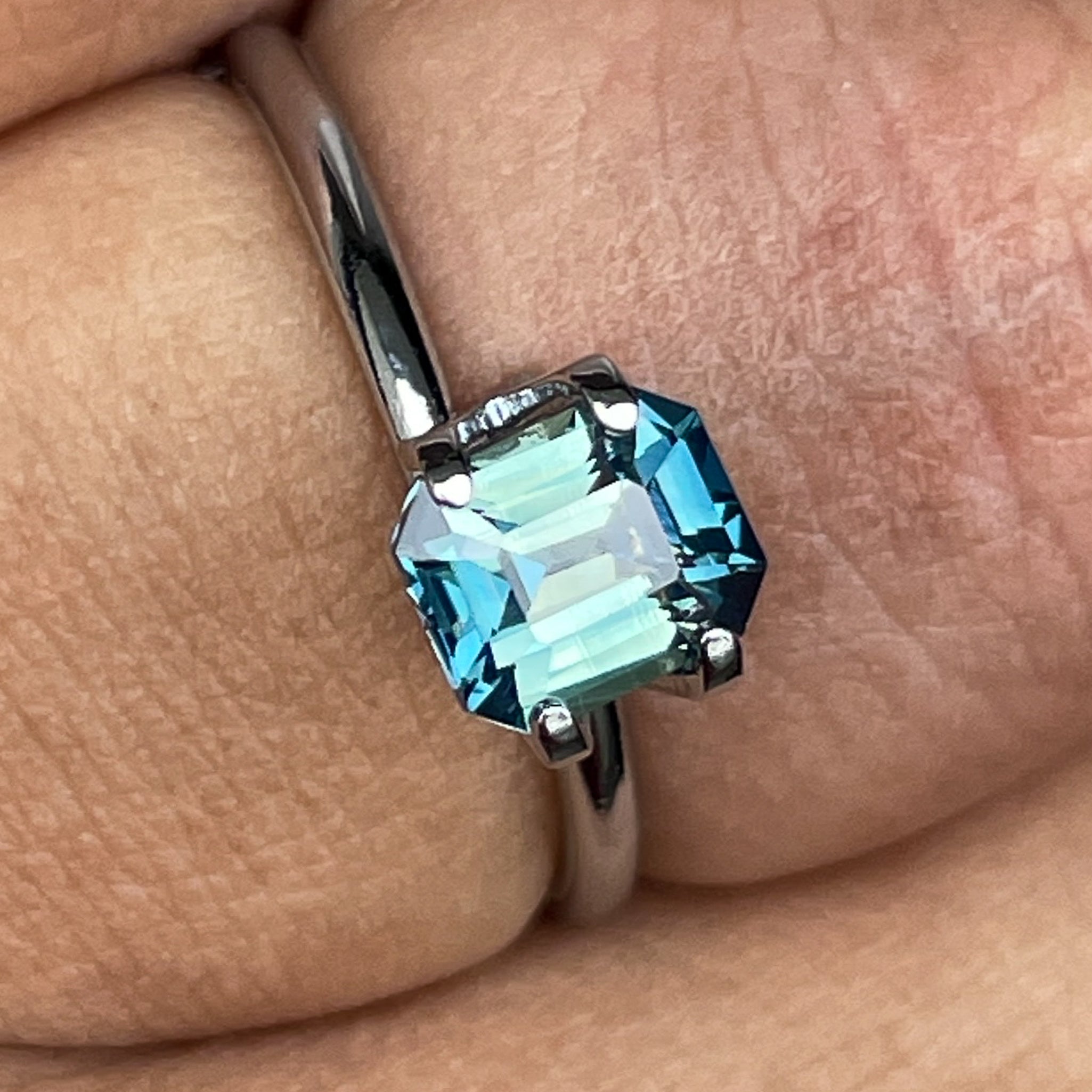Natural teal and green bi-color sapphire, 1.38 ct emerald cut loose gemstone by NASHGEMS for engagement rings.