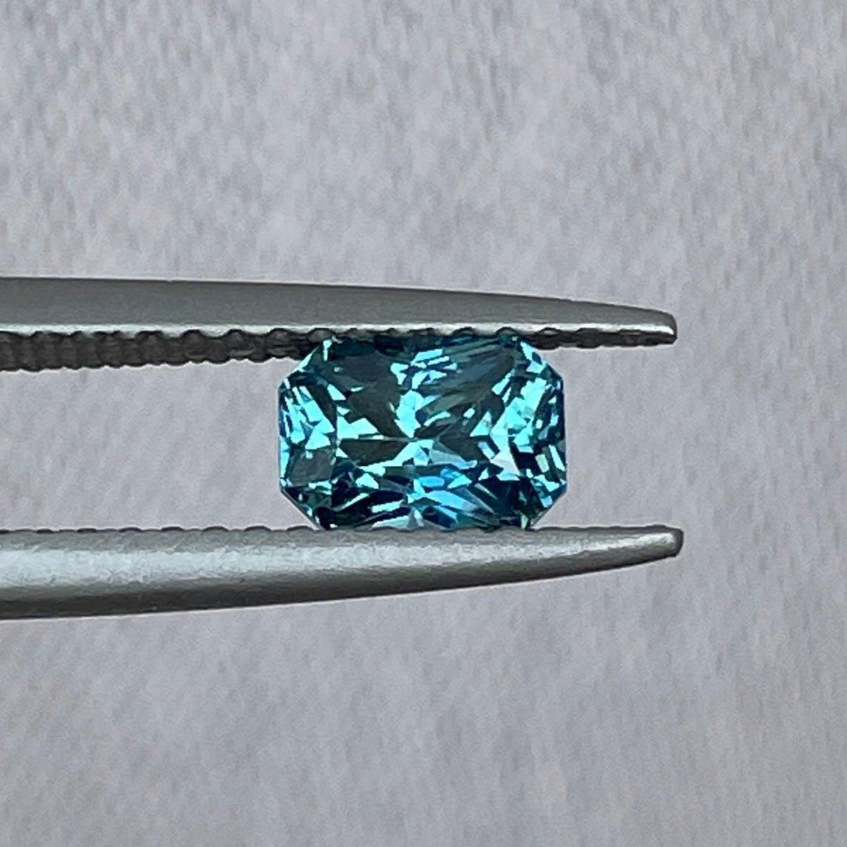 Blue-green teal sapphire gemstone, radiant cut 1.02 carats, loose precious jewel for women, by NASHGEMS.