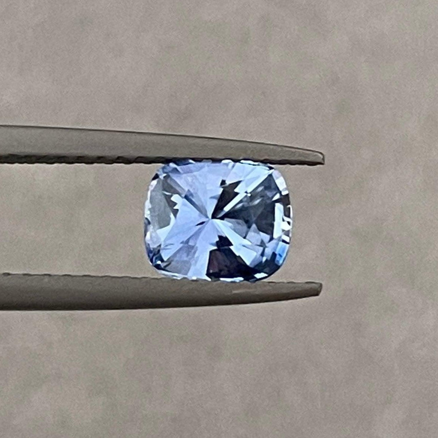 Blue sapphire jewelry including a 1.17 carat sapphire wedding band, pendant necklace, and engagement ring by NASHGEMS.