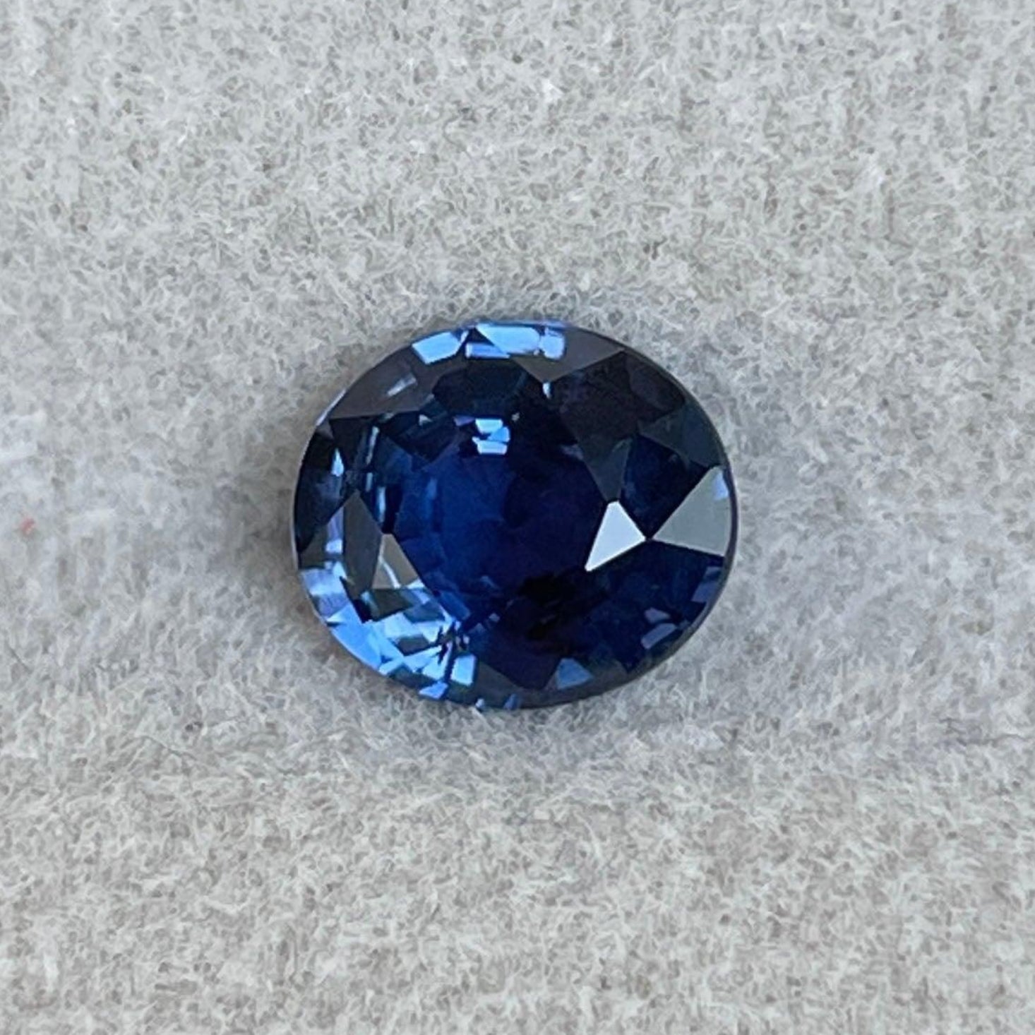 Blue sapphire jewelry from NASHGEMS including a 1.06 carat blue sapphire wedding band, pendant necklace, and engagement ring.