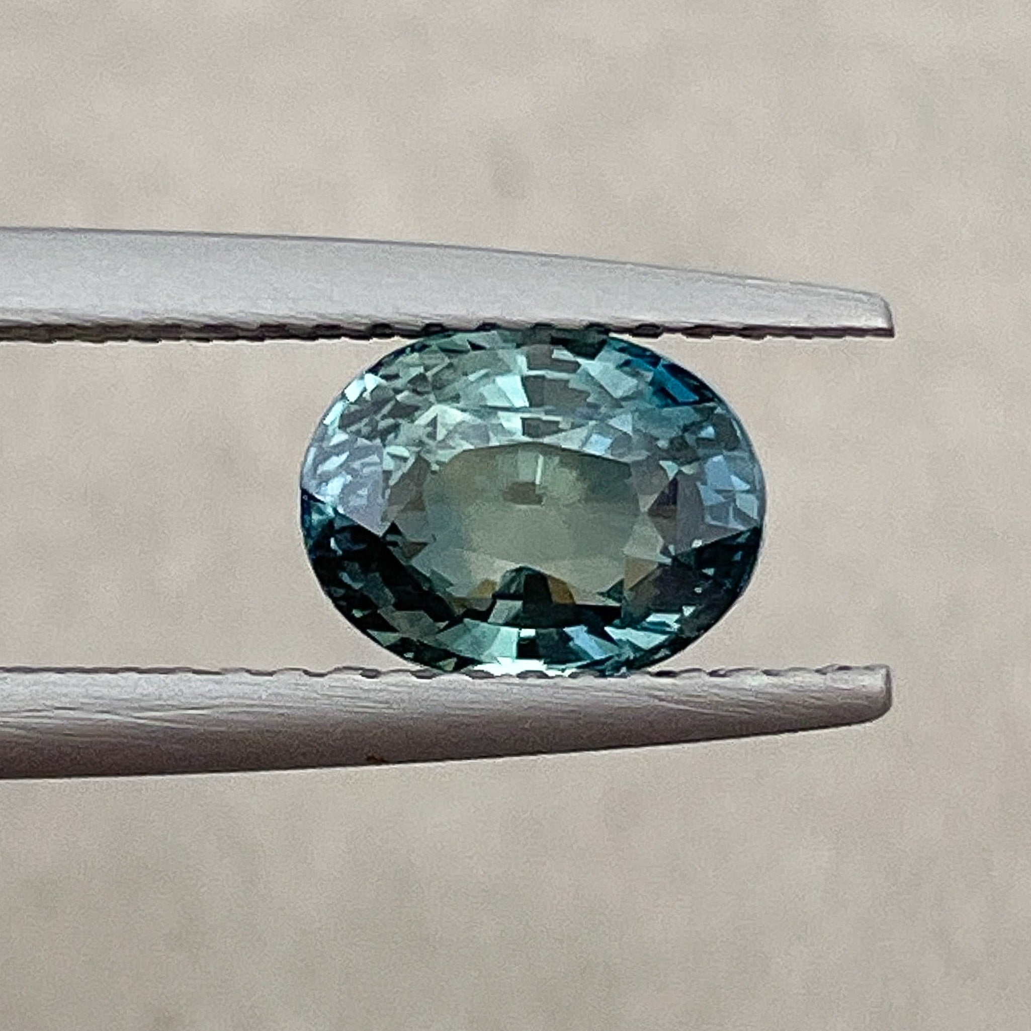 Natural teal blue-green sapphire, 2.03 Ct oval cut loose gemstone by NASHGEMS, ideal for engagement rings or custom jewelry.