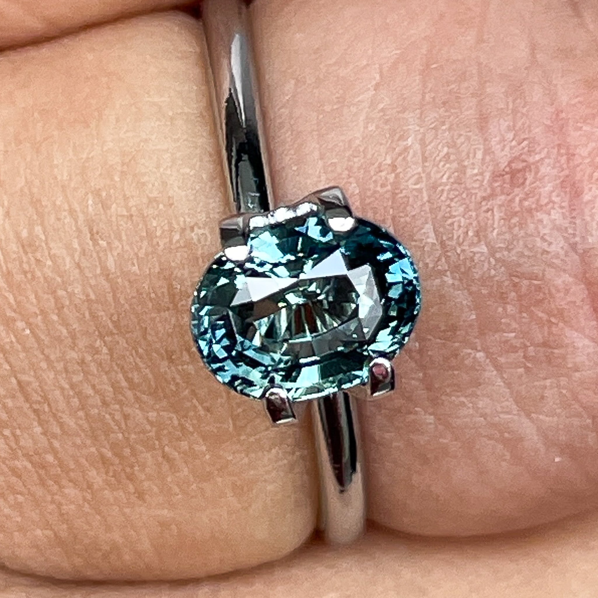 Natural teal blue-green sapphire, 2.03 Ct oval cut loose gemstone by NASHGEMS, ideal for engagement rings or custom jewelry.