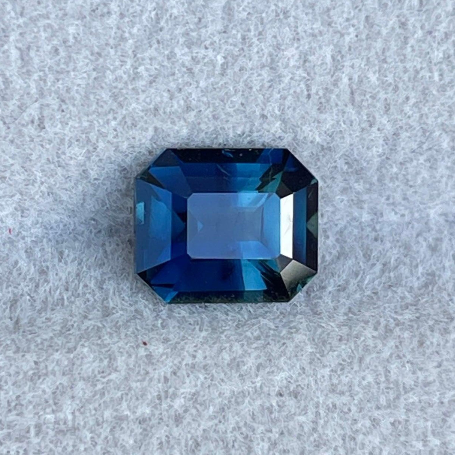 Teal sapphire birthstone from NASHGEMS, 1.62 Ct bluish-green precious stone for September engagement rings and jewelry.