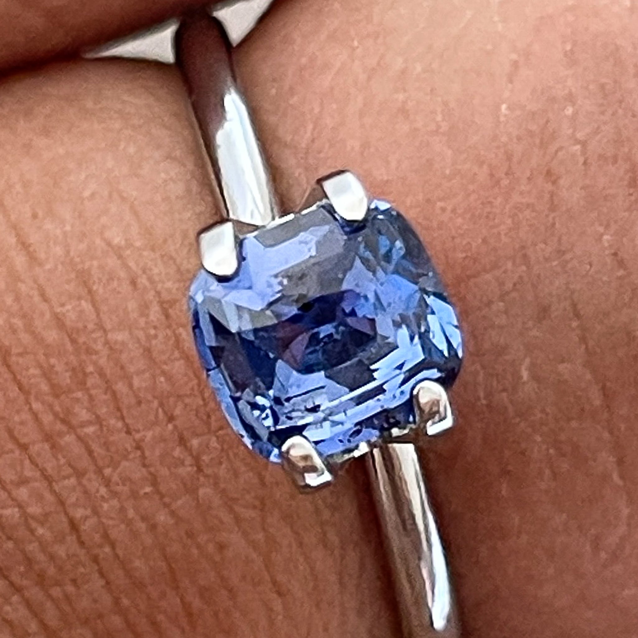 Natural Ceylon Blue Sapphire 1.06 Ct cushion cut loose gemstone by NASHGEMS, showcasing vibrant blue color and detailed cut.