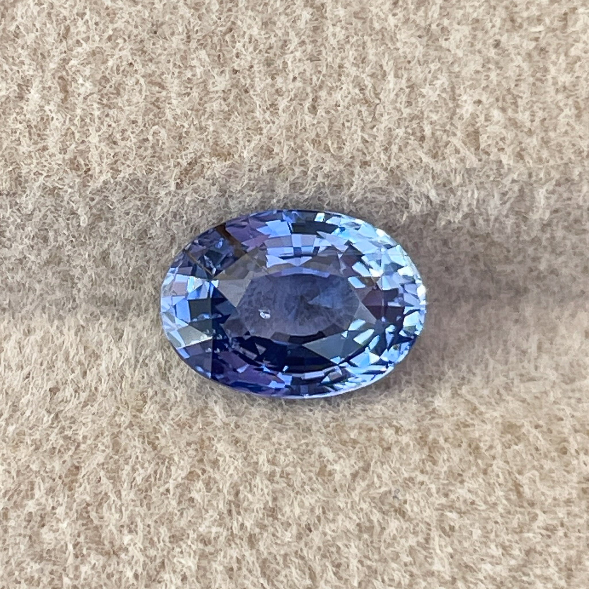 Natural Ceylon Blue Sapphire 1.54 Ct oval cut loose gemstone by NASHGEMS, showcasing vibrant blue color and polished surface.