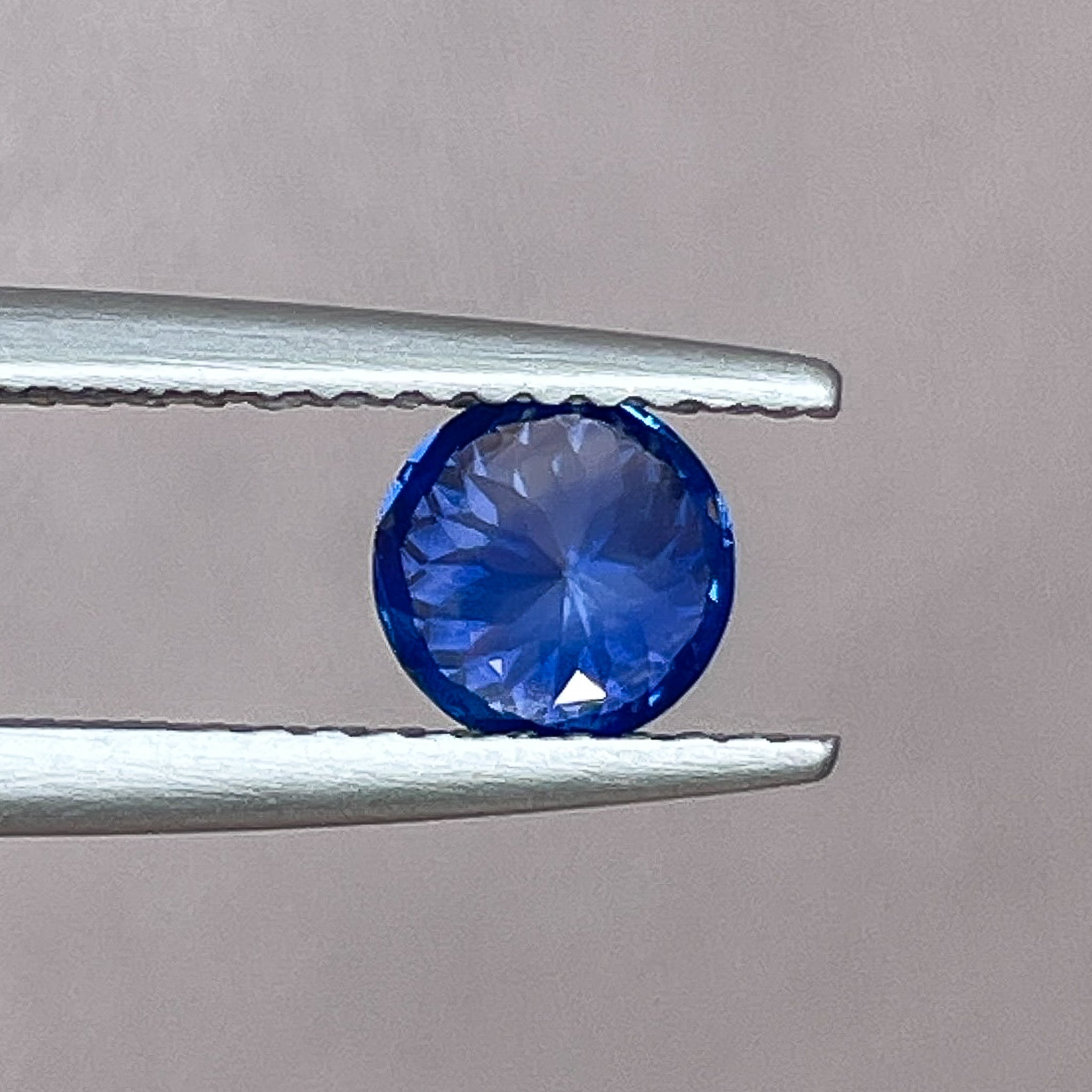 Natural Ceylon blue sapphire loose gemstone, 0.80 ct round cut VVS clarity, ideal for engagement rings by NASHGEMS.