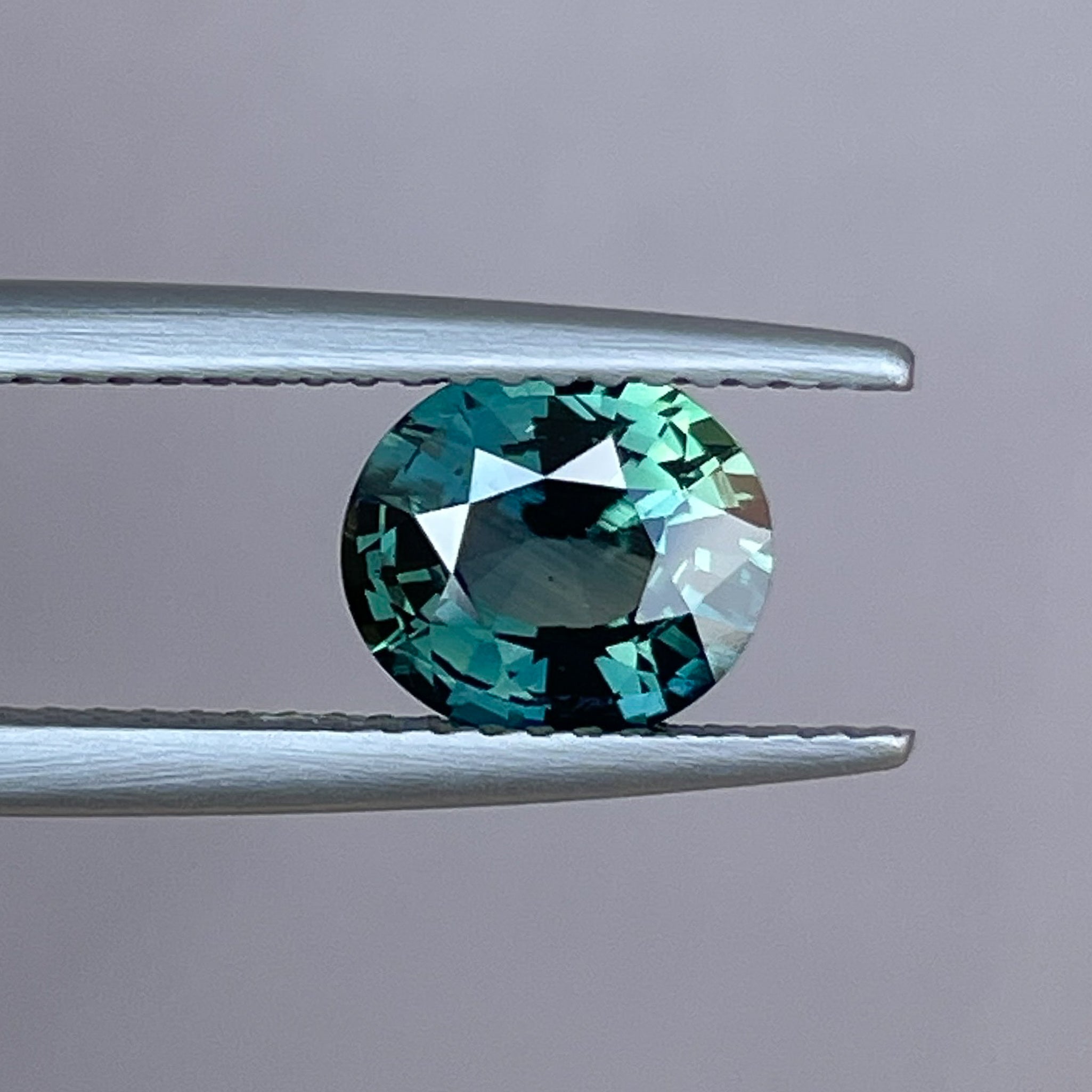 Teal forest green sapphire, 1.56 Ct oval cut loose gemstone by NASHGEMS, ideal for engagement rings or custom jewelry.