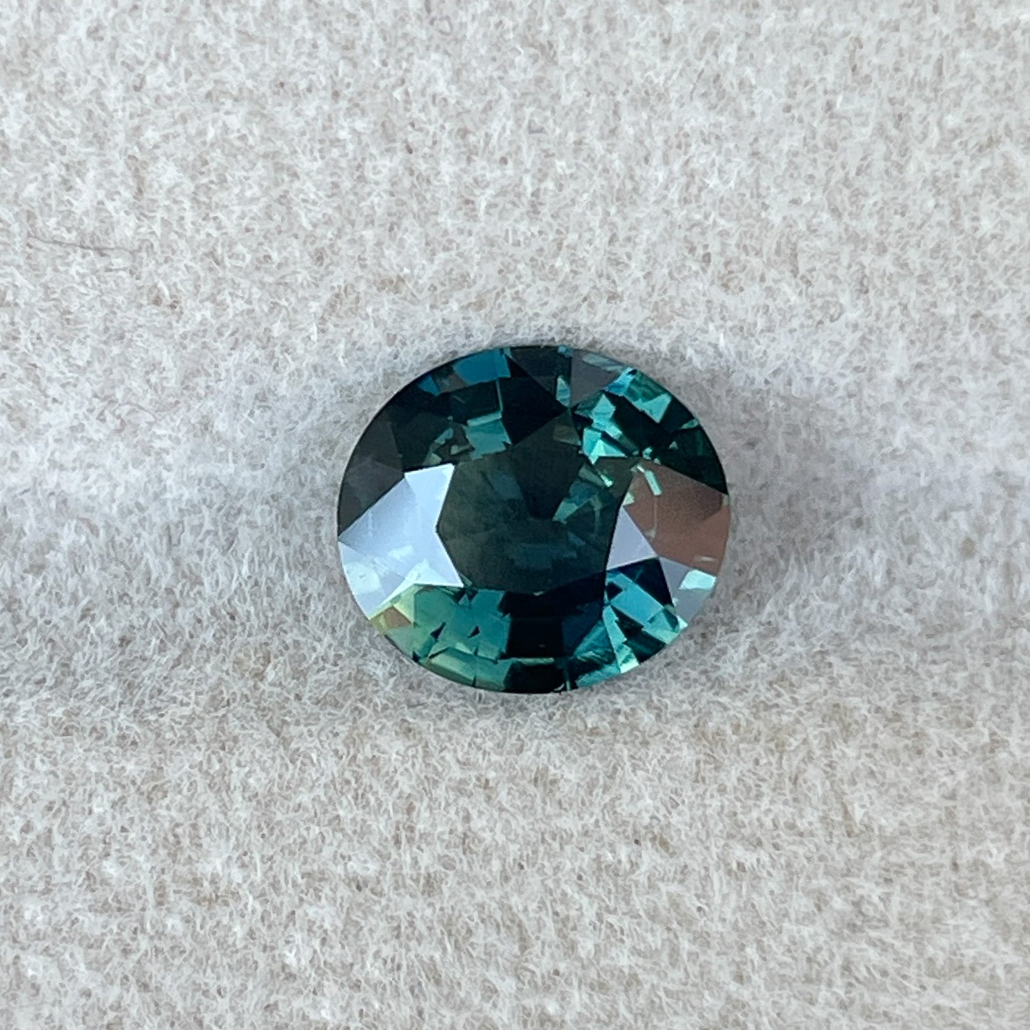 Natural forest green sapphire, 1.56 Ct oval cut loose teal gemstone by NASHGEMS, ideal for engagement rings or custom jewelry.