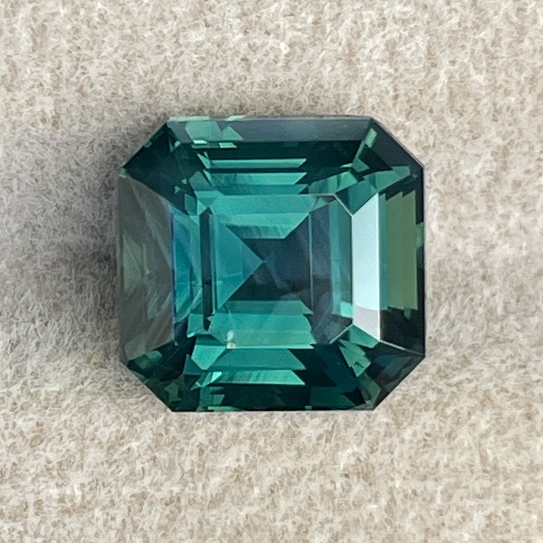 Natural green sapphire 5.08 Ct Asscher emerald cut by NASHGEMS, showcasing a stunning teal loose sapphire for jewelry.