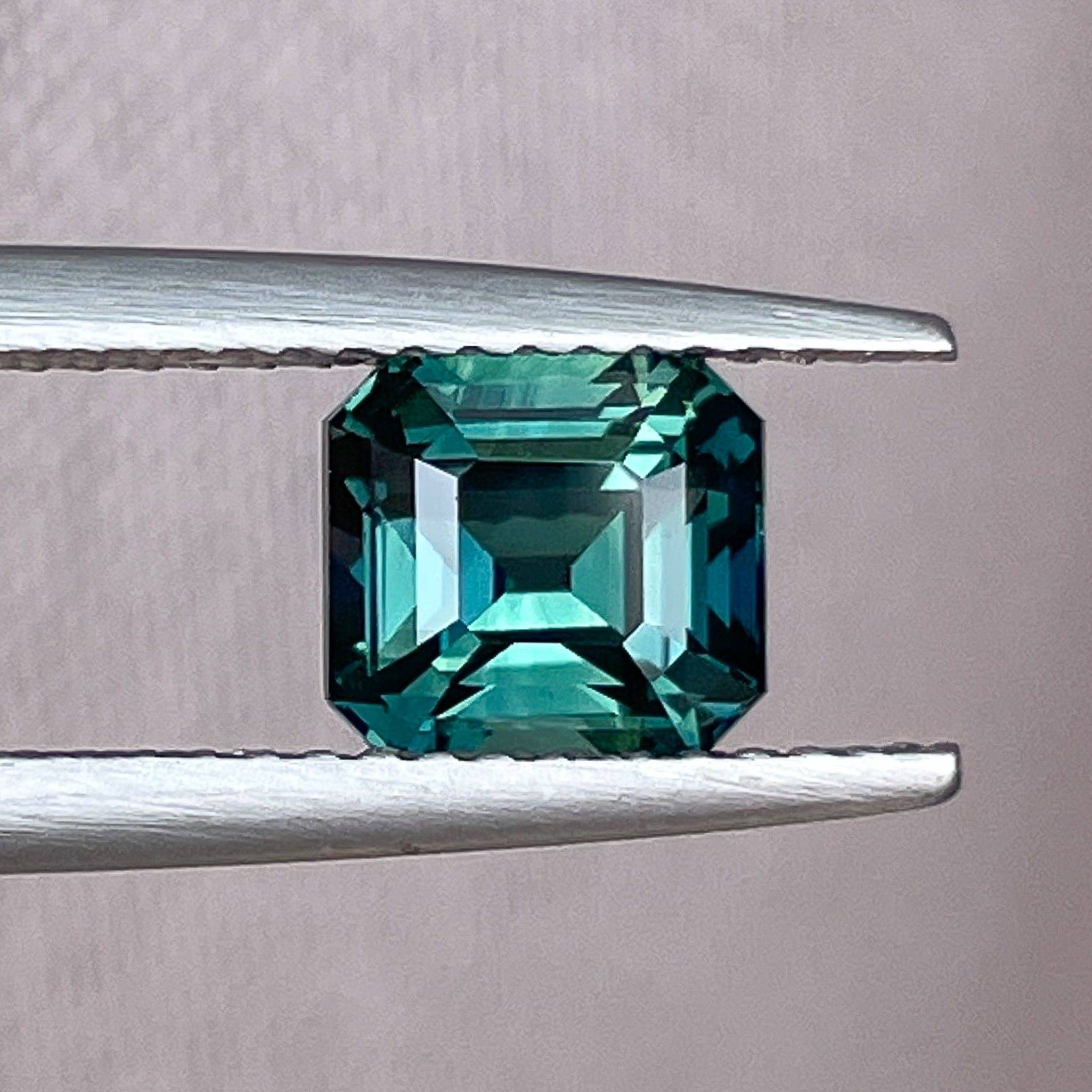 Teal green sapphire loose gemstone, 2.02 Ct emerald cut, heat-treated natural sapphire by NASHGEMS for custom engagement rings.