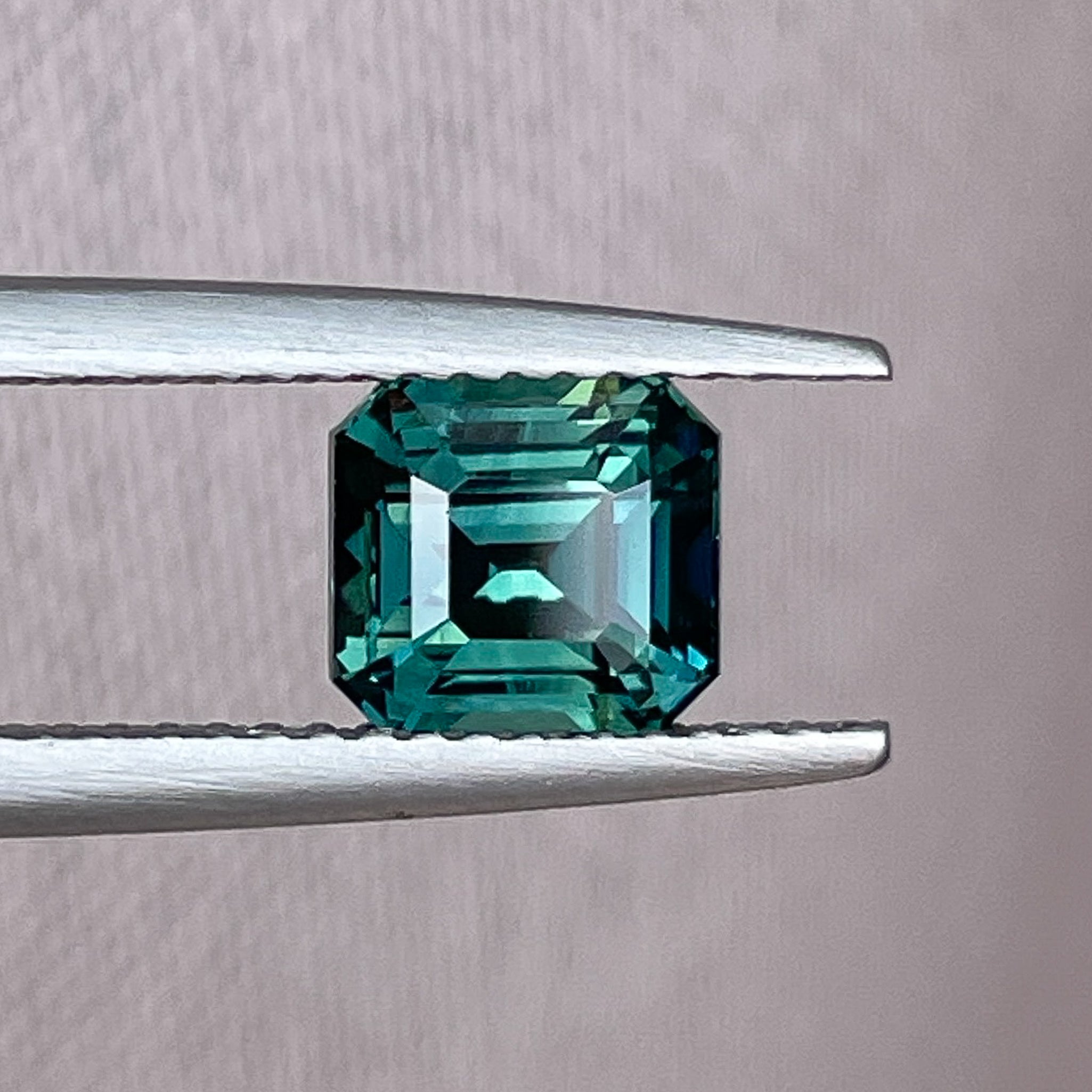 Teal green sapphire loose gemstone, 2.02 Ct emerald cut, heat-treated natural sapphire by NASHGEMS for custom engagement rings.