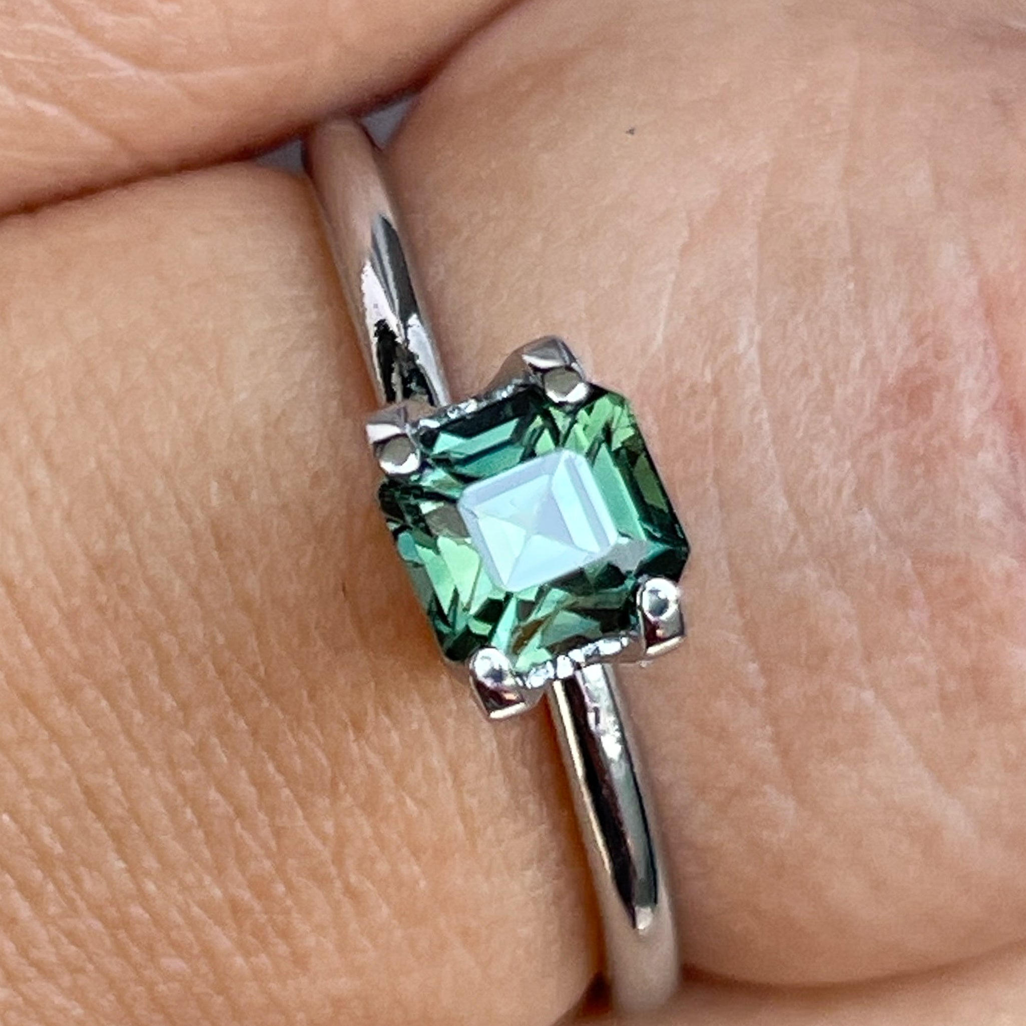 Natural forest green sapphire, 1.09 Ct emerald cut loose gemstone by NASHGEMS, ideal for engagement rings or custom jewelry.