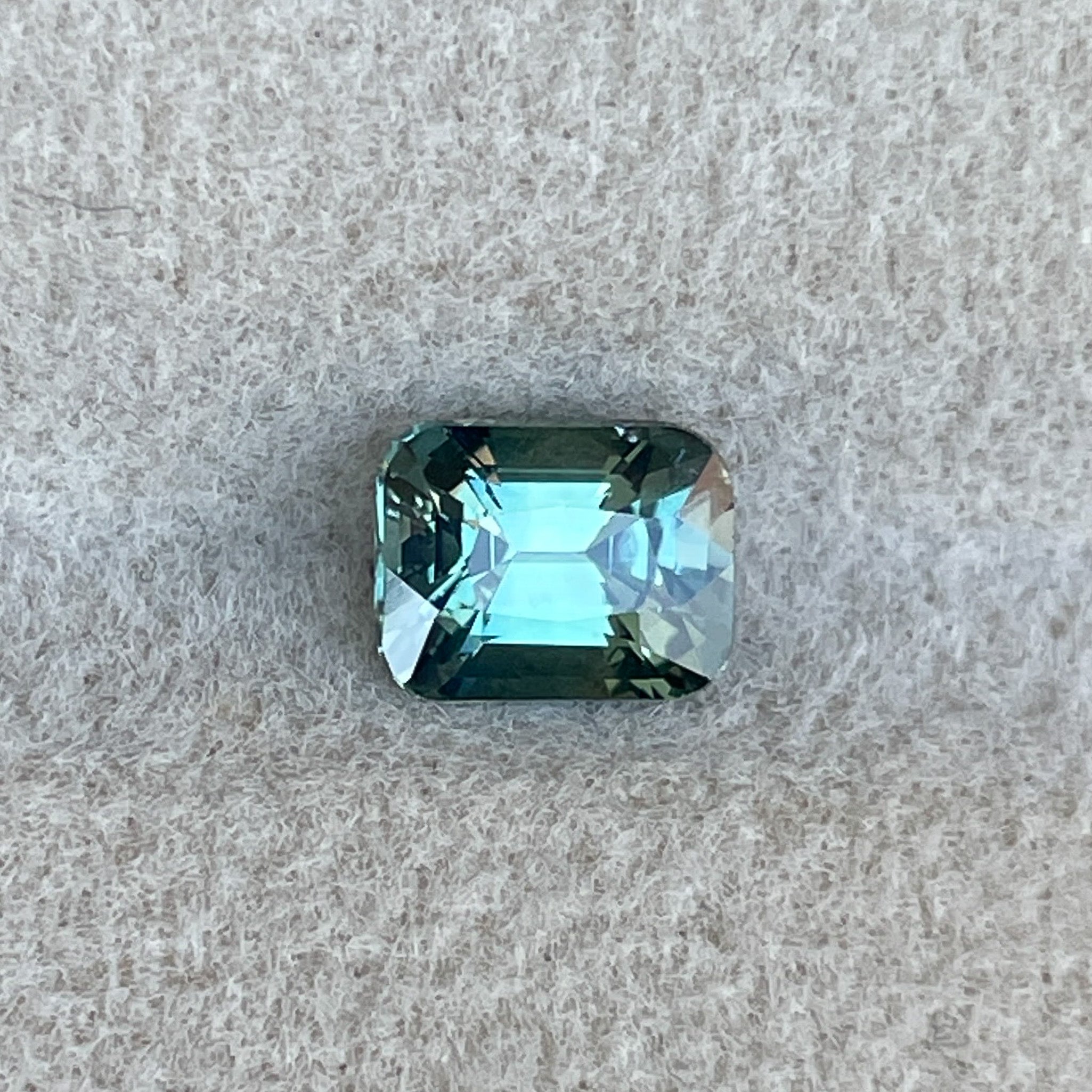 Natural teal green sapphire 1.11 Ct cushion cut loose gemstone by NASHGEMS, ideal for engagement rings or custom jewelry.