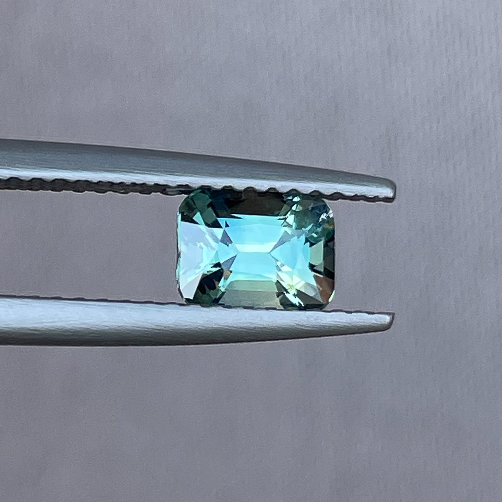 Natural teal green sapphire 1.11 Ct cushion cut loose gemstone by NASHGEMS, ideal for engagement rings or custom jewelry.